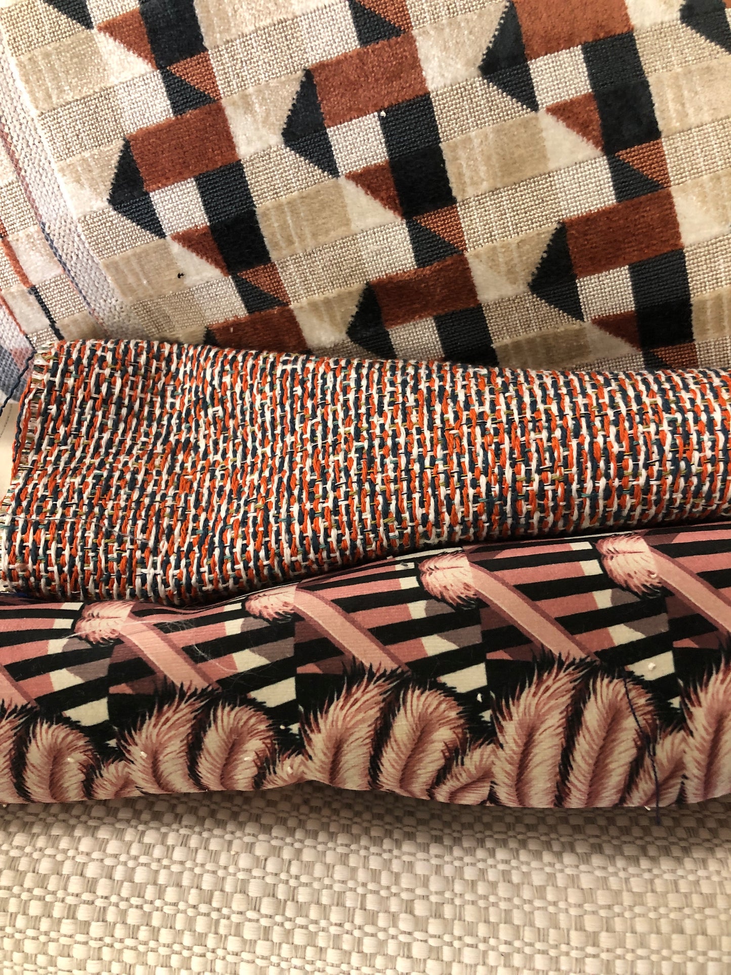 Close-up of various textured fabric samples in a patterned 