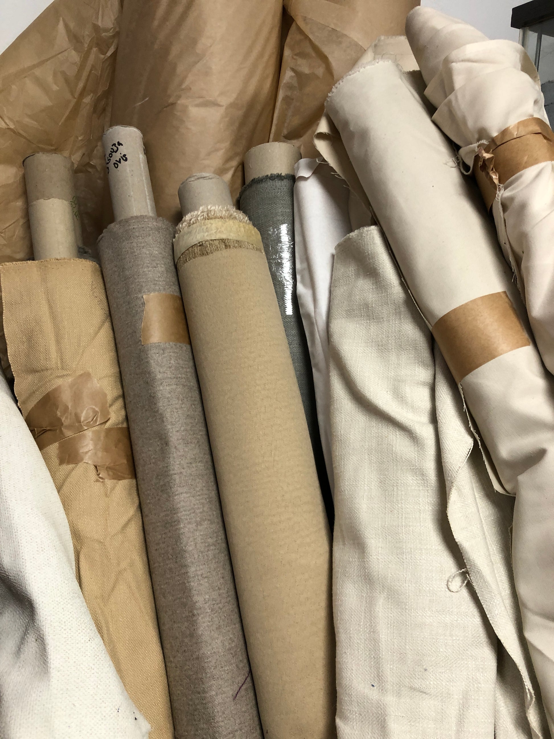 Close-up of various textured fabric samples in a patterned 