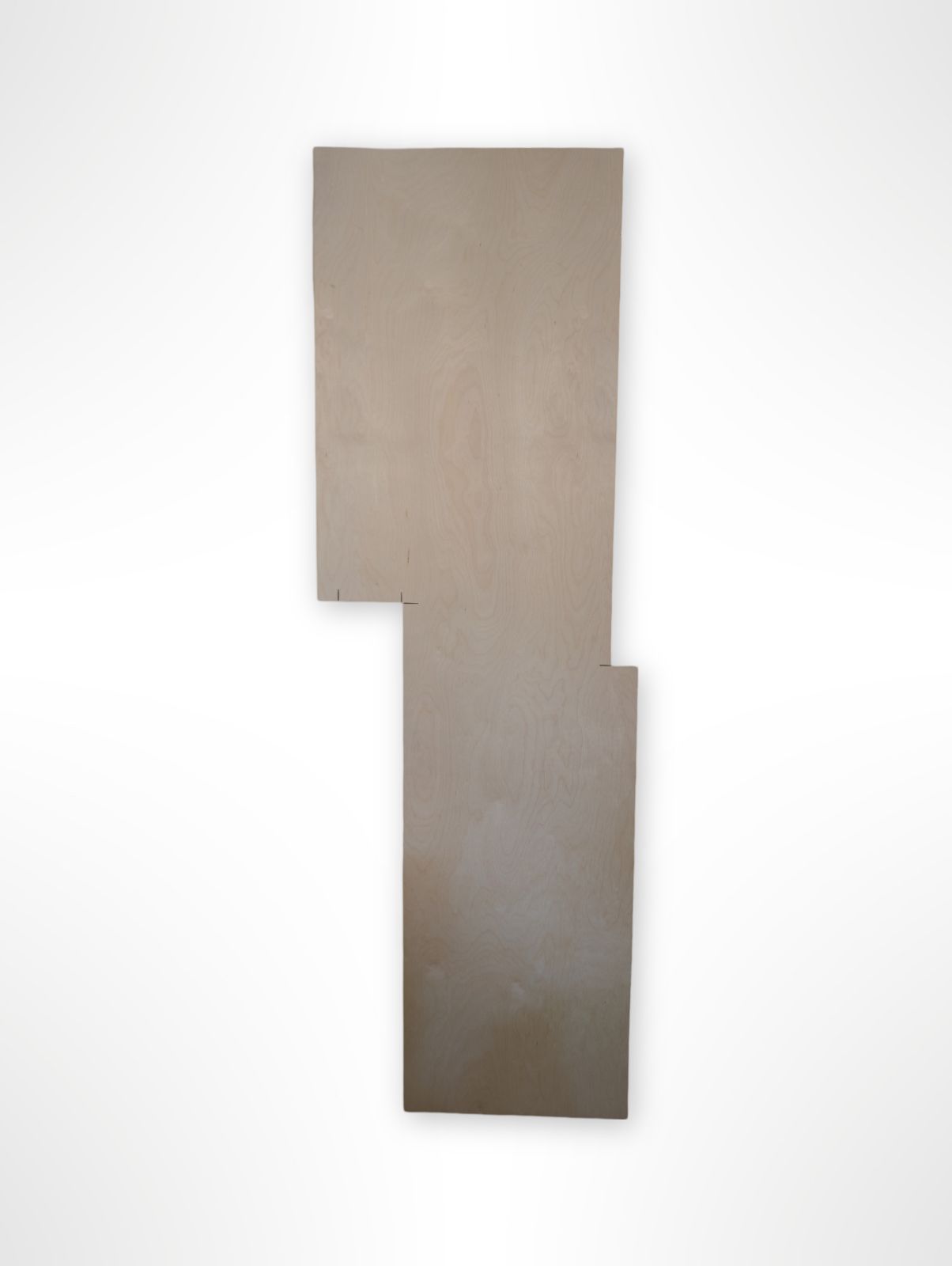 A reclaimed birch plywood sheet with a visible grain pattern, slightly irregular shape, suggested for crafting and woodworking projects.