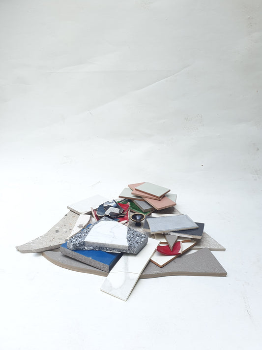 Collection of broken tiles in various colours and sizes 