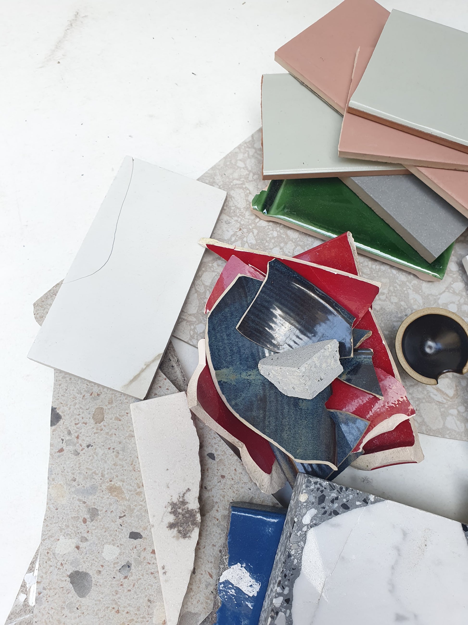 Collection of broken tiles in various colours and sizes 
