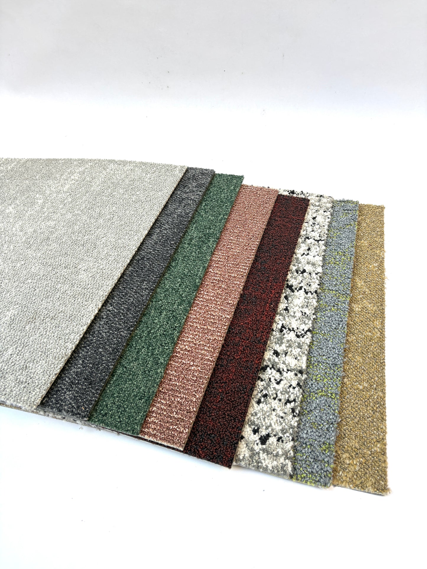 Collection of large square pieces of carpet samples in various colours 
