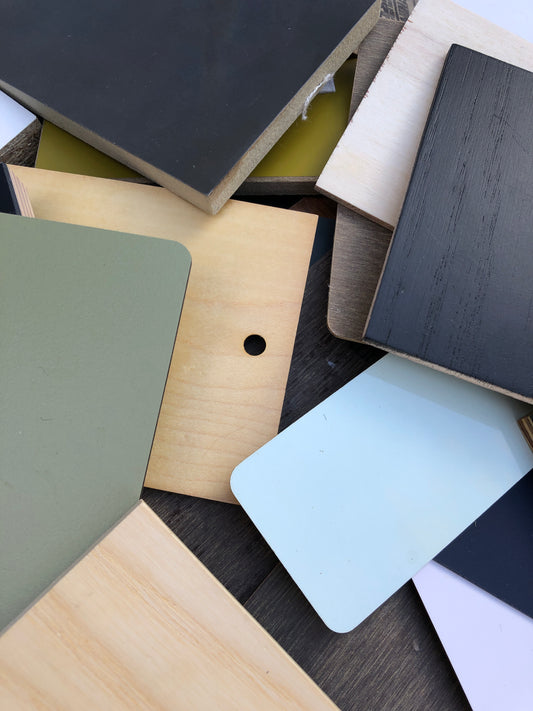 Stack of colour-coated wood samples in various sizes 
