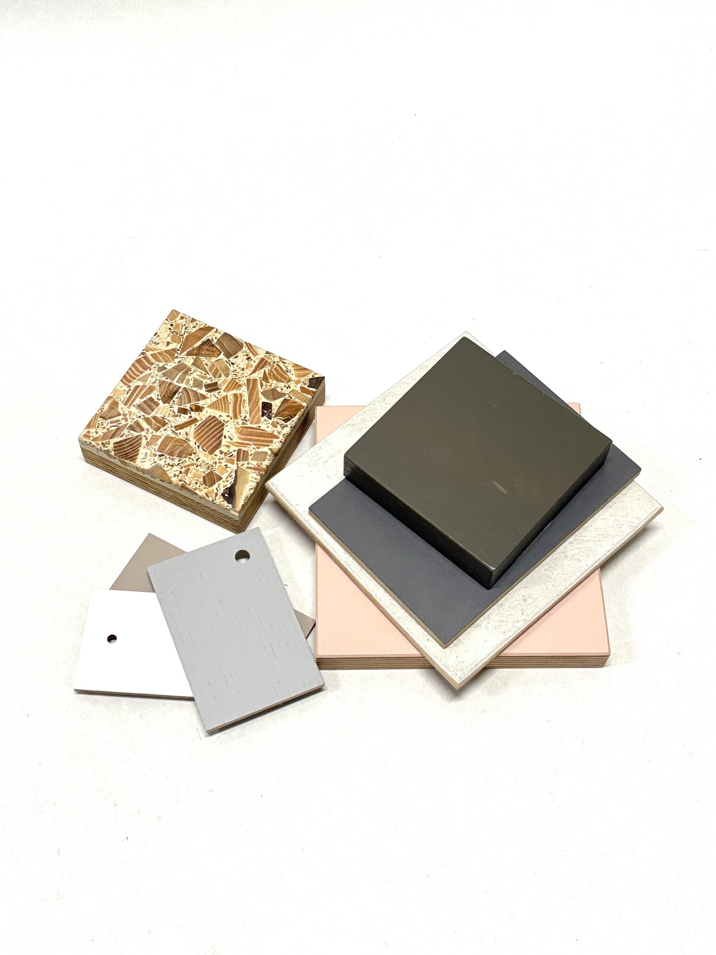 Stack of colour-coated wood samples in various sizes 