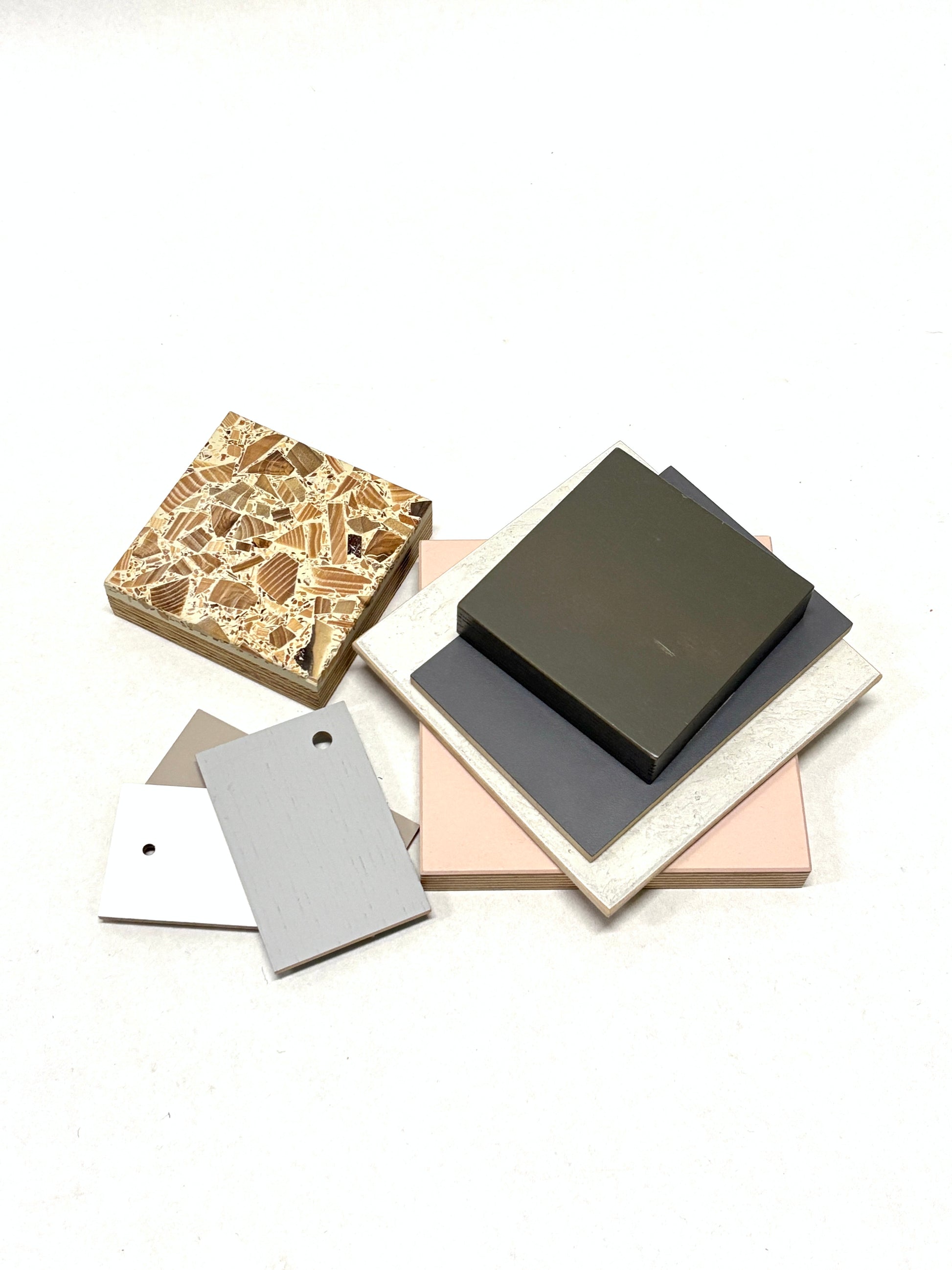 Stack of colour-coated wood samples in various sizes 