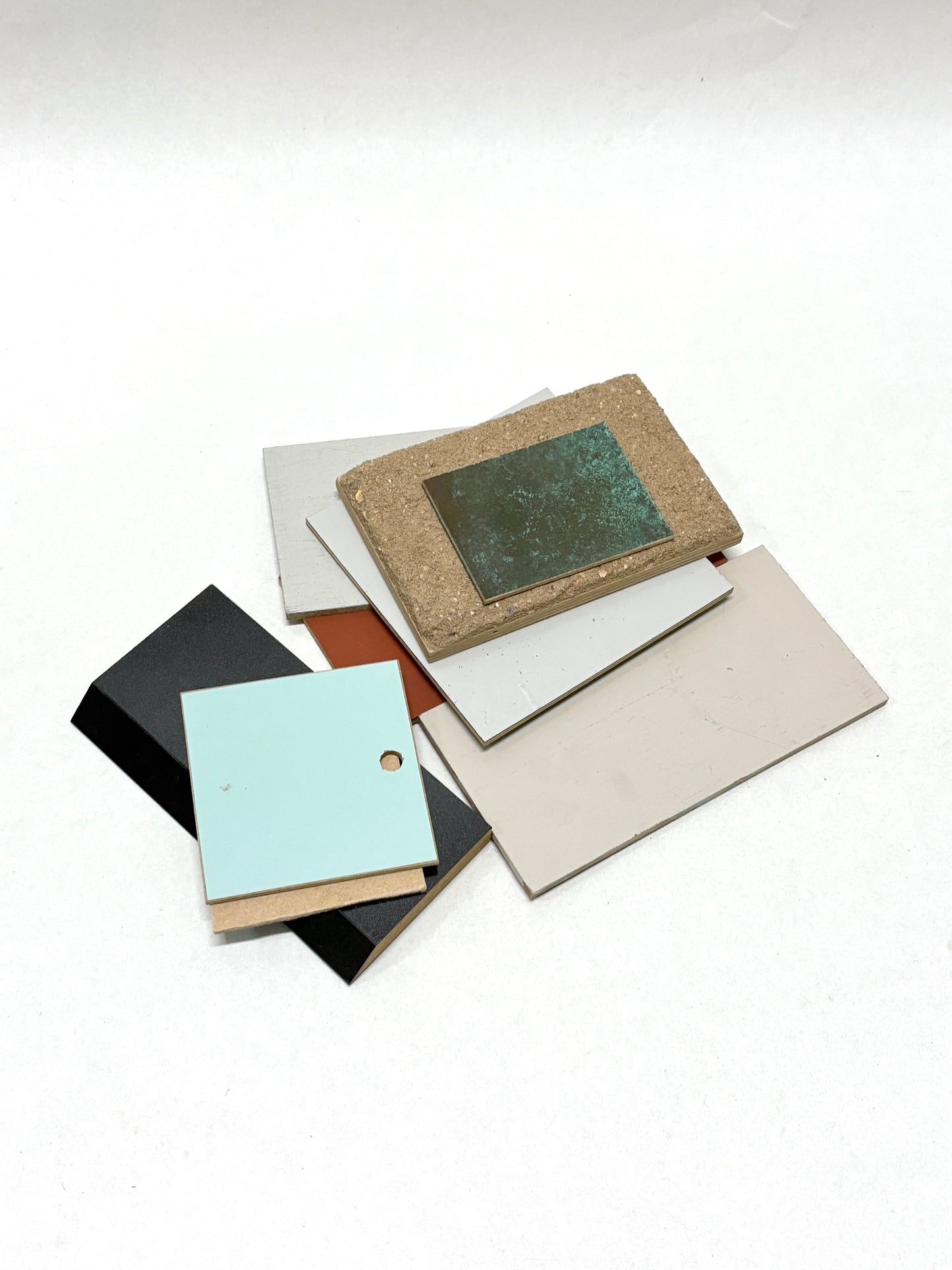 Stack of colour-coated wood samples in various sizes 