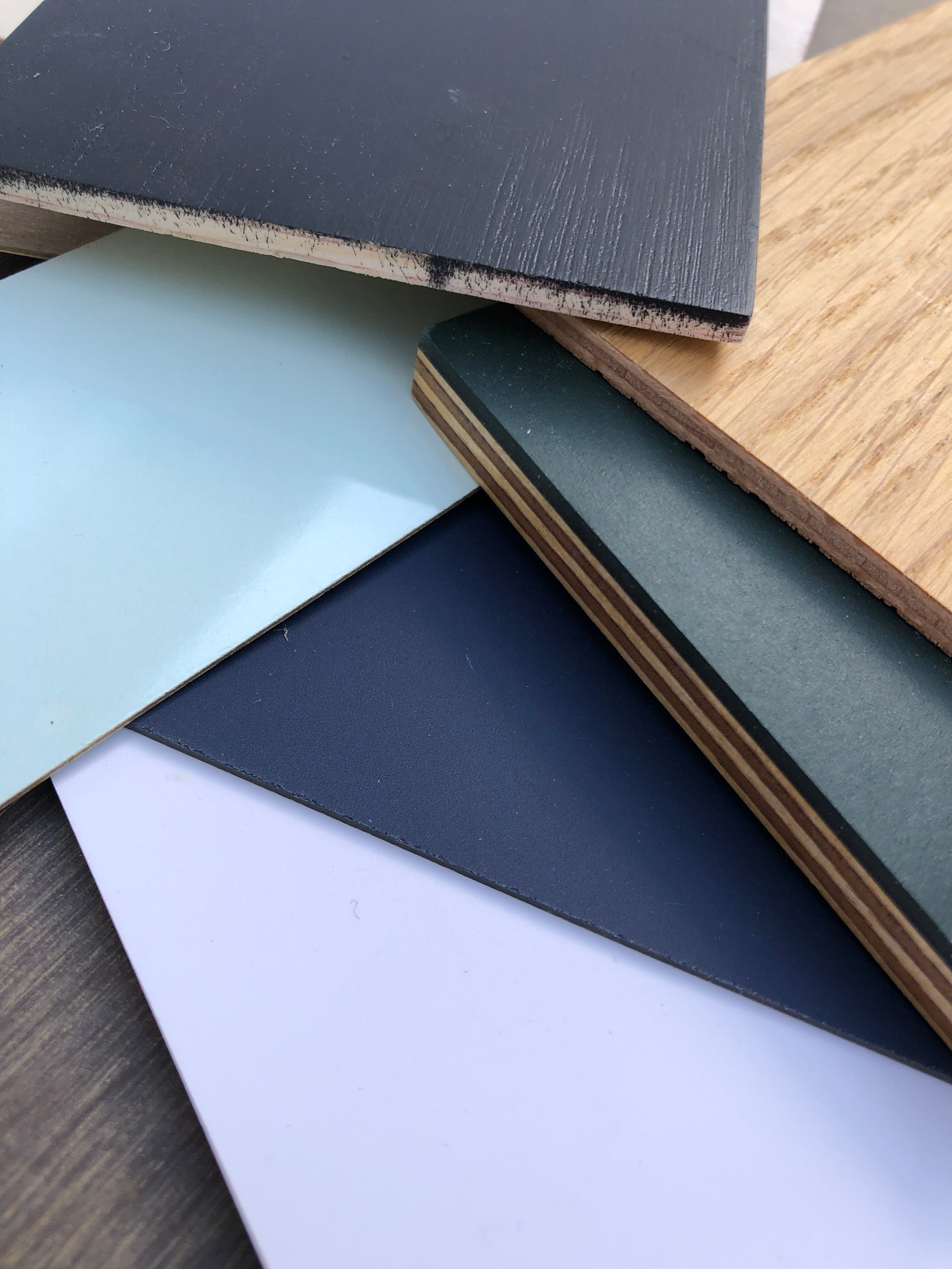 Stack of colour-coated wood samples in various sizes 