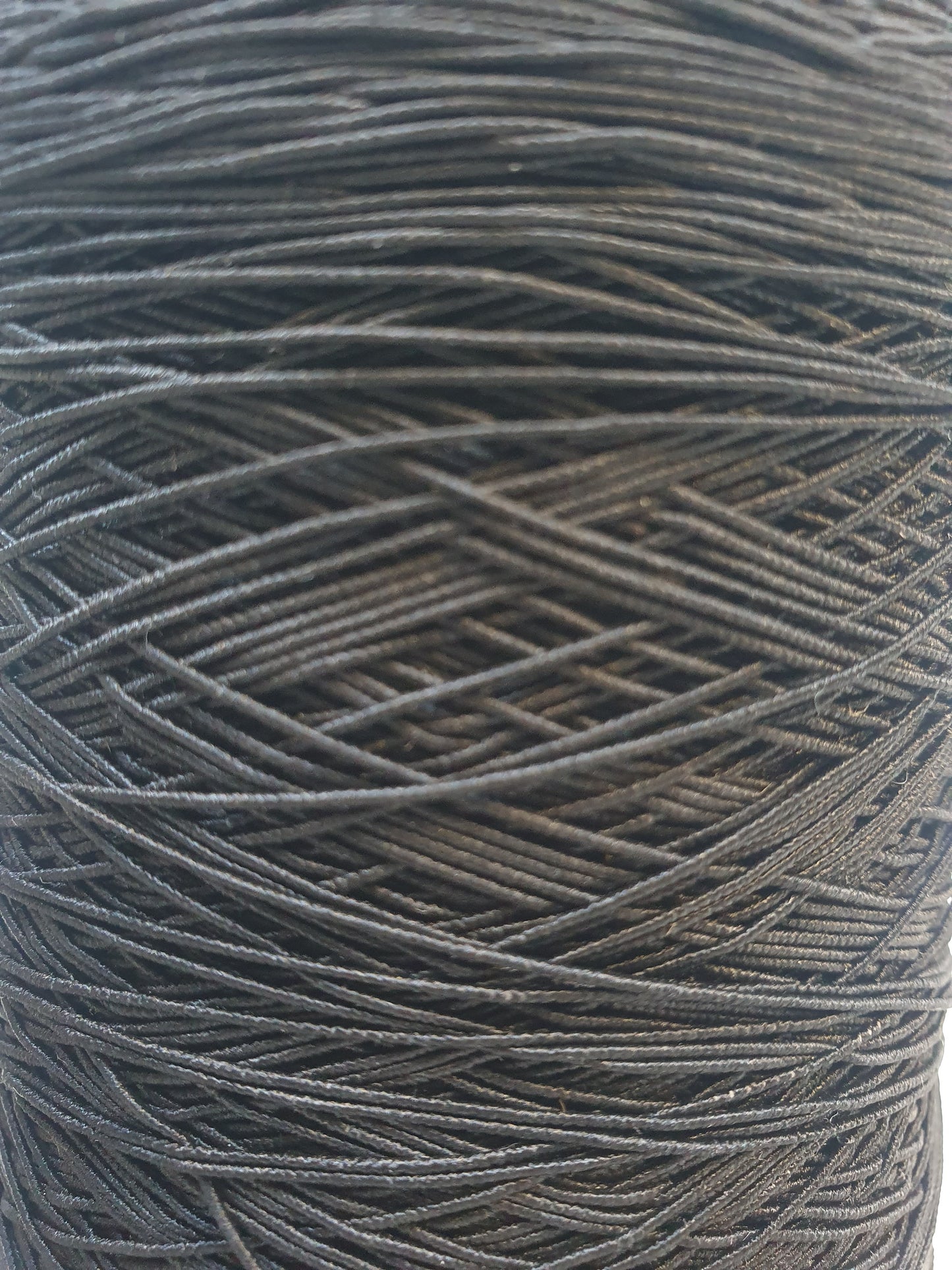 Close-up of a black elastic cord roll