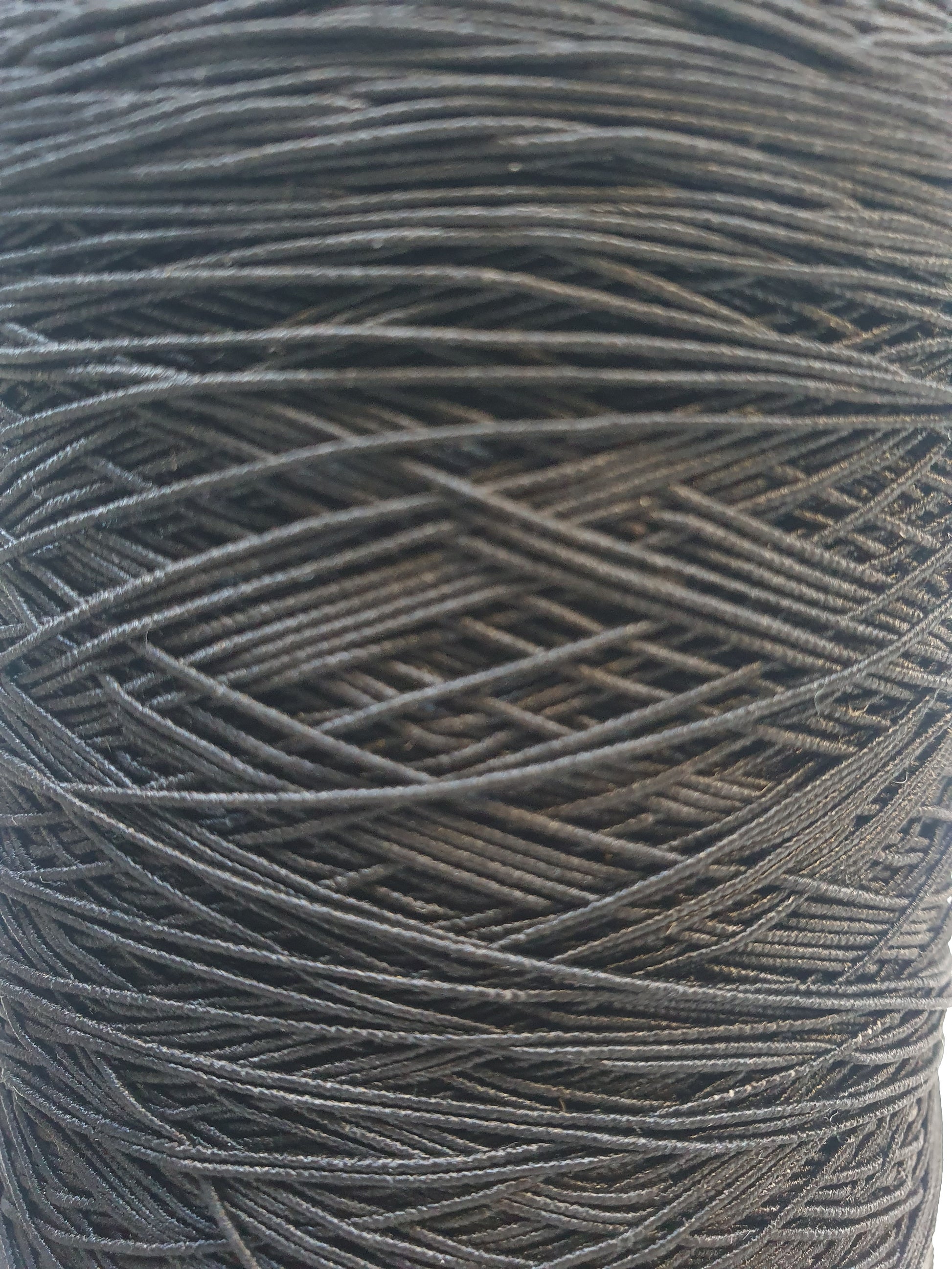 Close-up of a black elastic cord roll