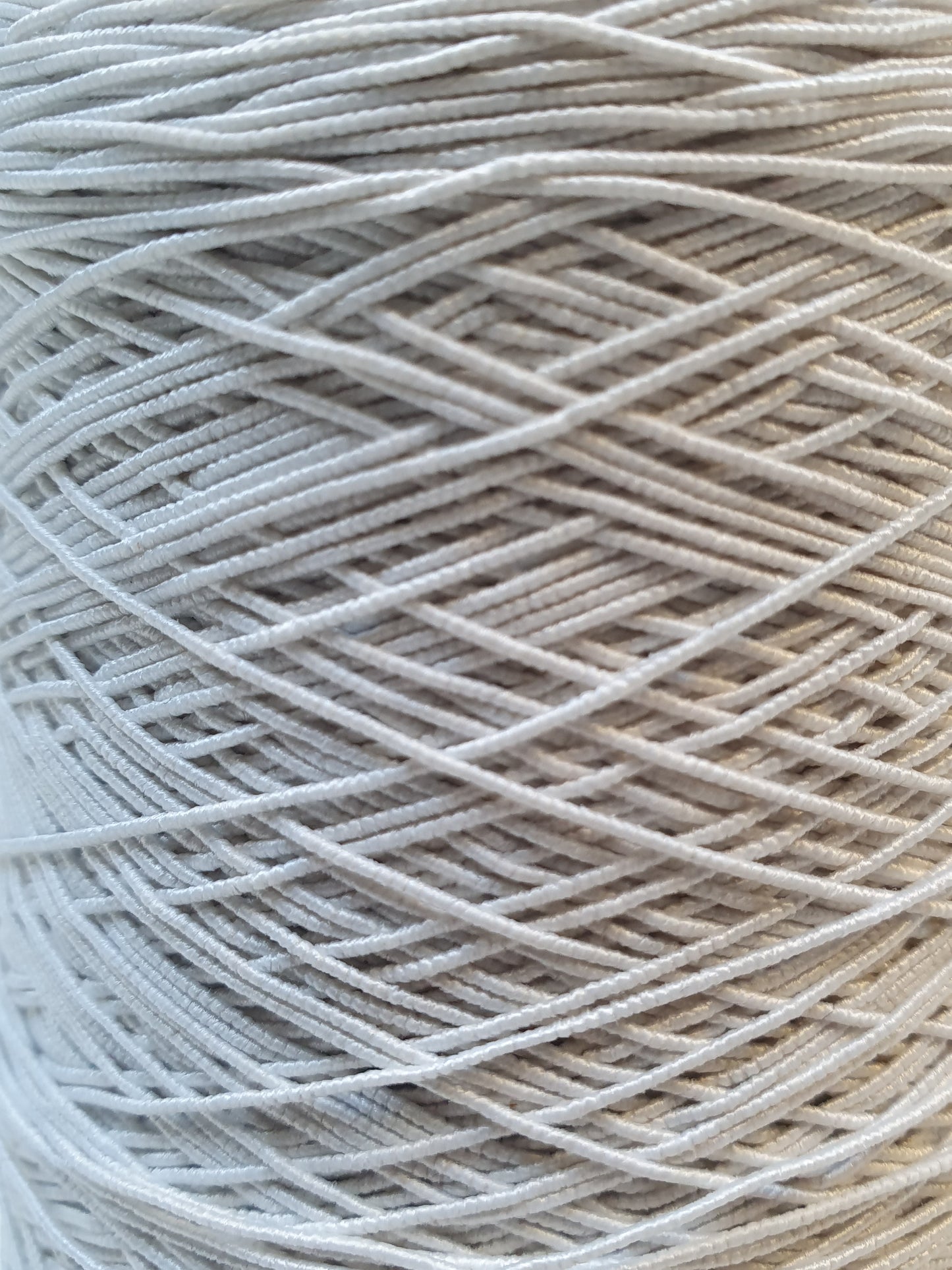 Close-up of white elastic cord roll