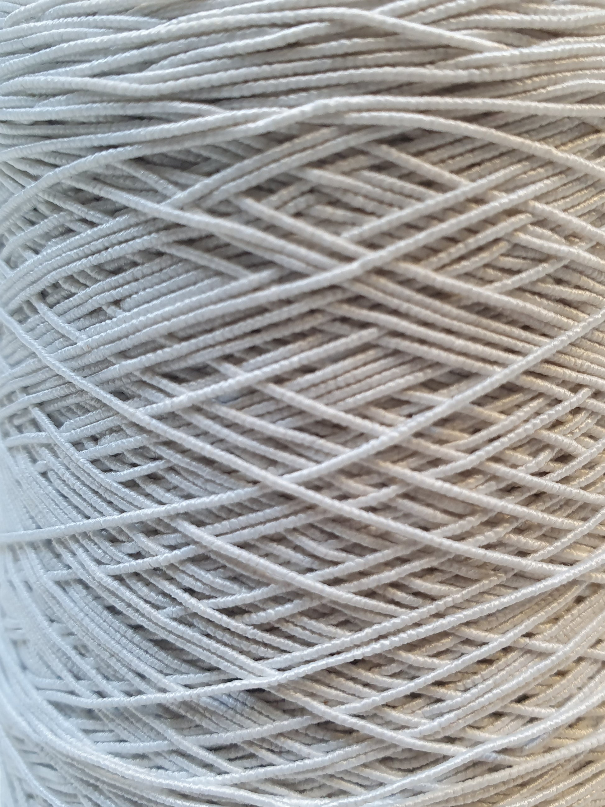 Close-up of white elastic cord roll