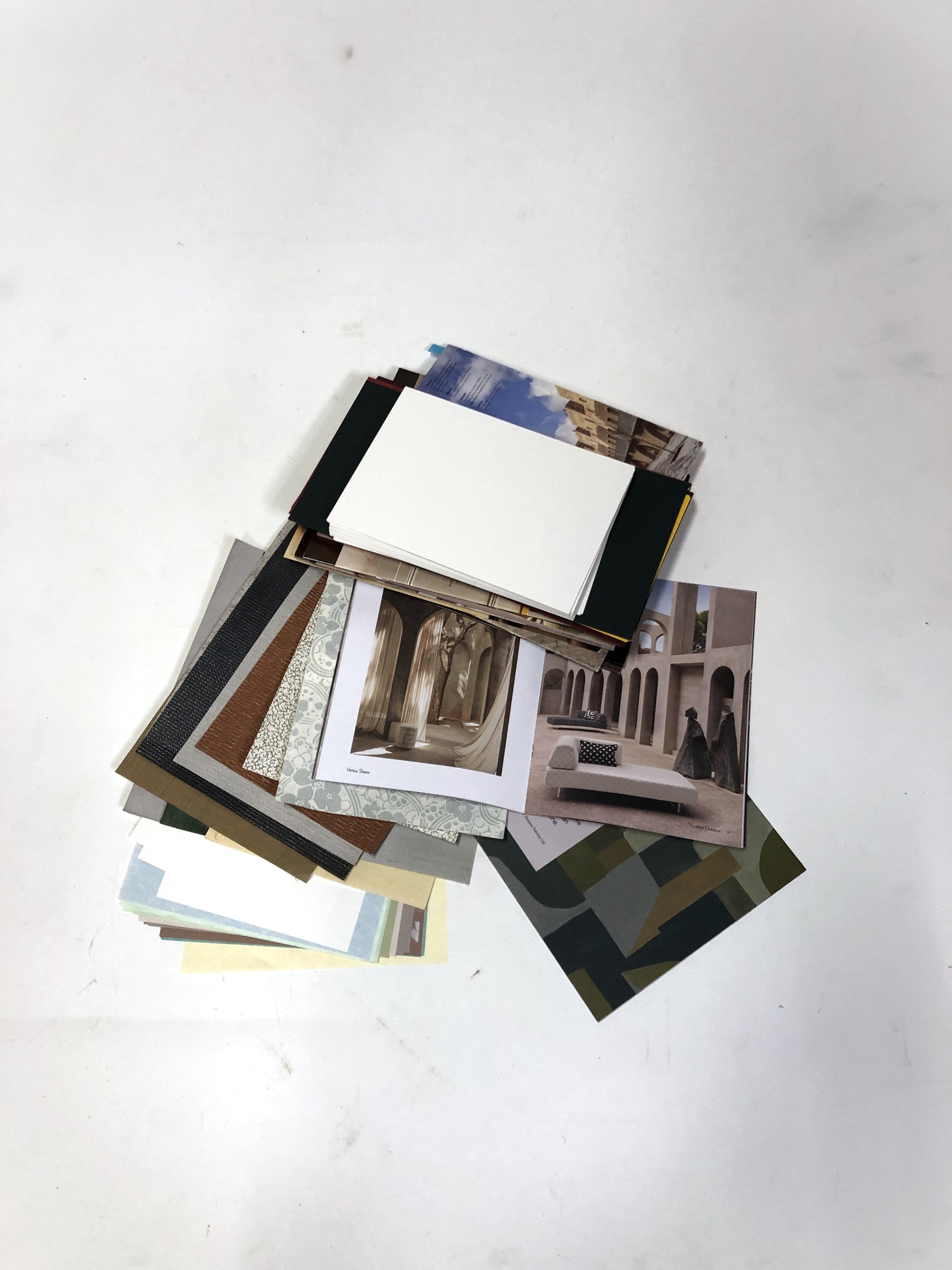 Collection of greeting card-making kits, including magazine scraps