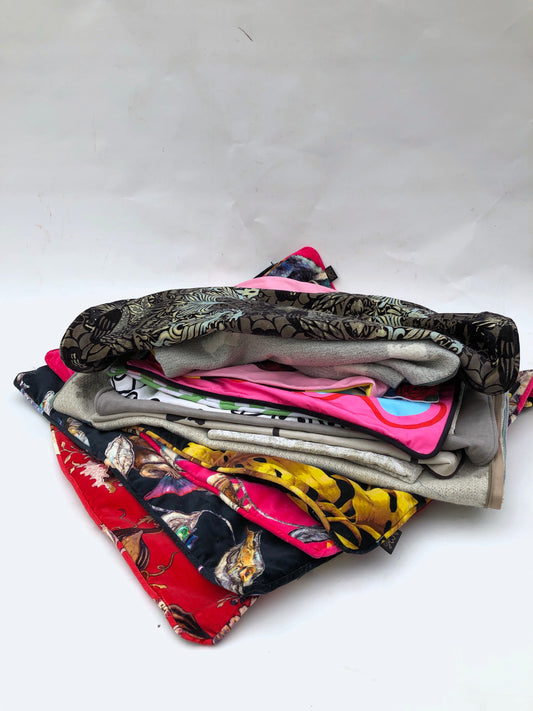 Stack of cushion covers in various patterns and colours