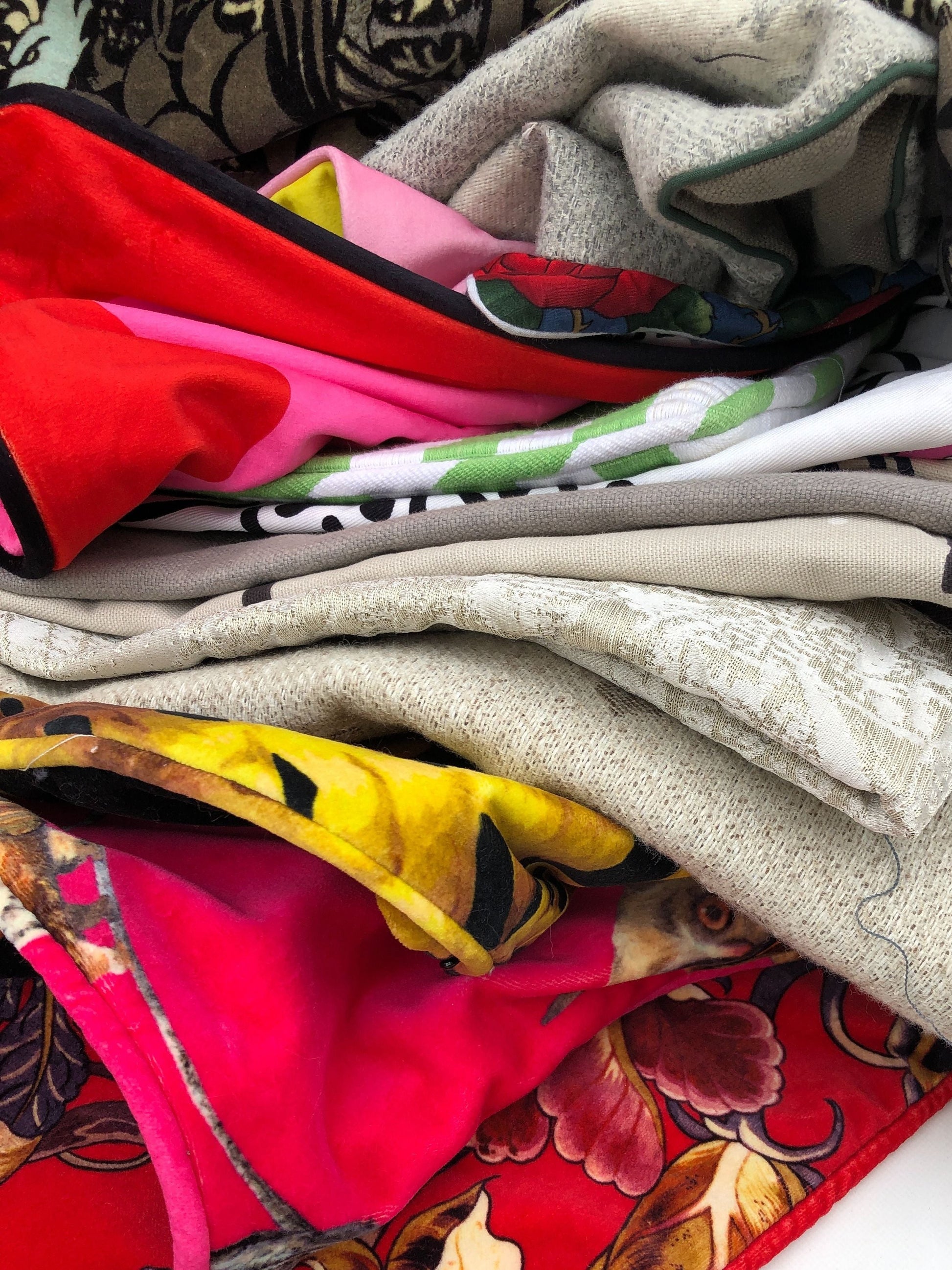 Stack of cushion covers in various patterns and colours