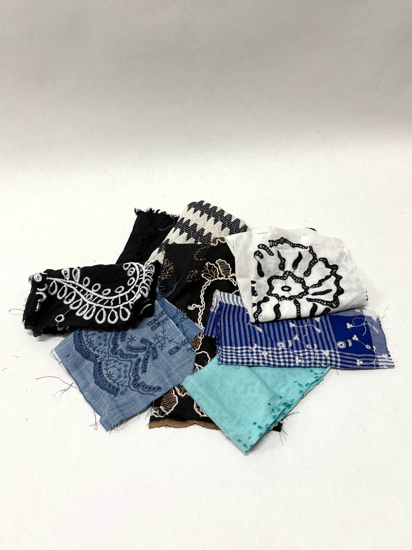 Collection of decorative lace fabric offcuts in various colours 