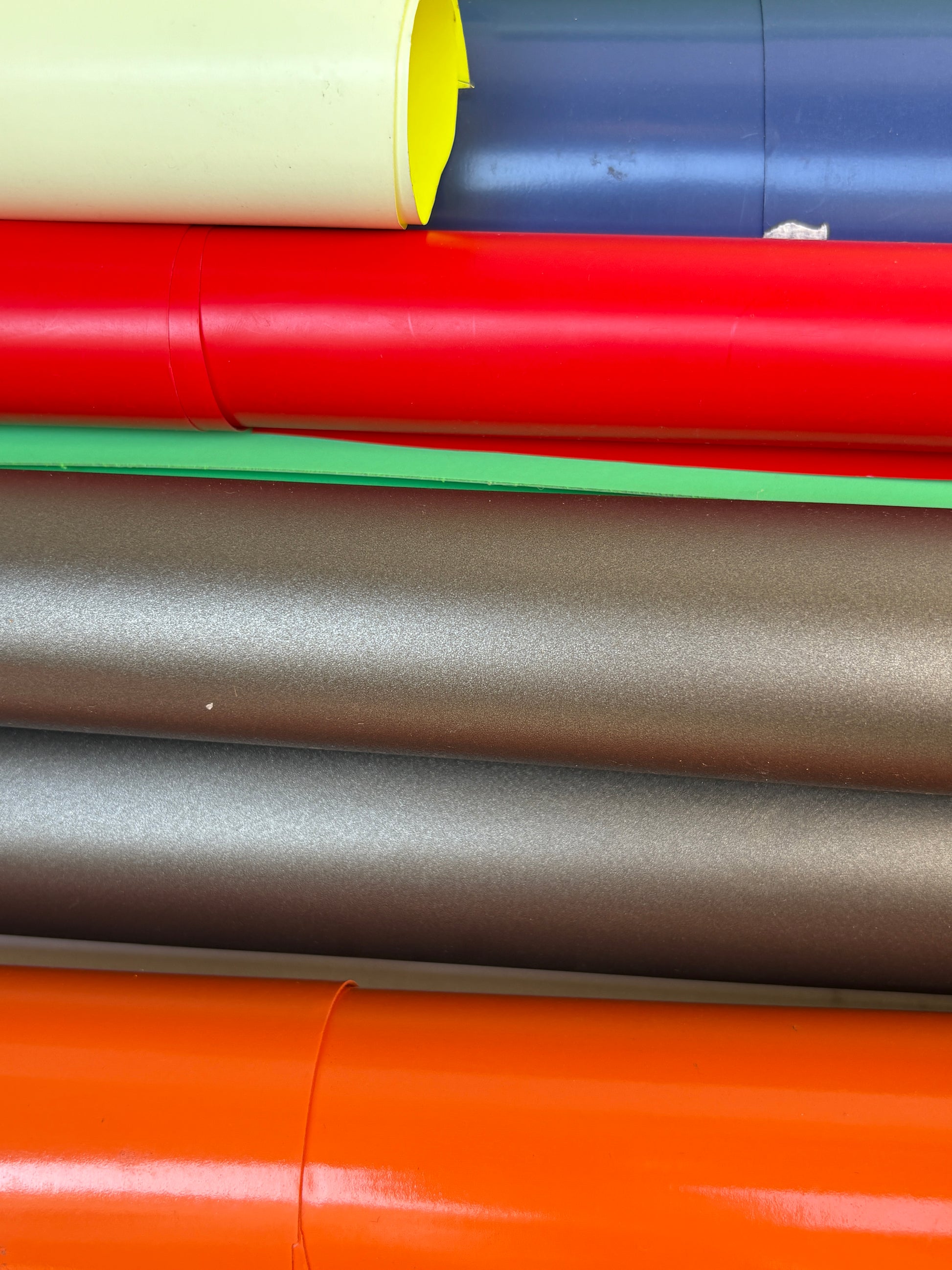 Collection of decorative paper vinyl rolls which are self-adhesive, in various colours 