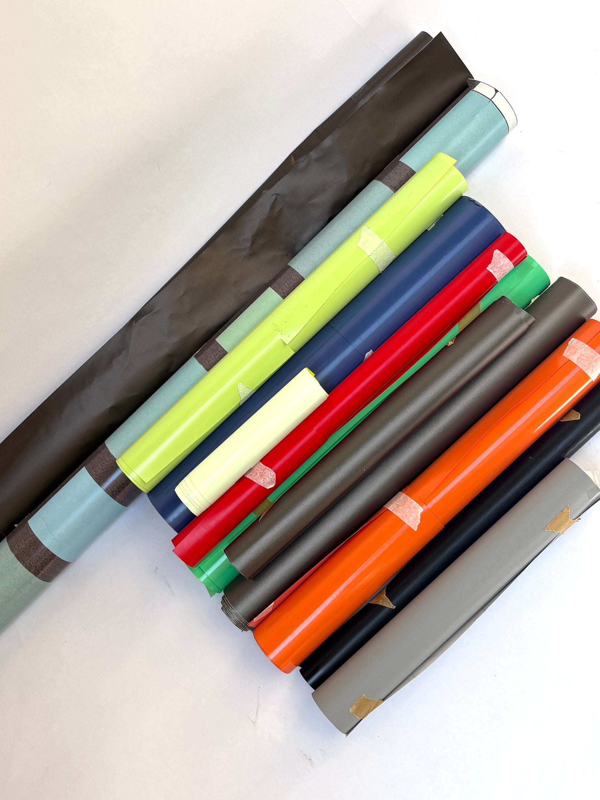 Collection of decorative paper vinyl rolls which are self-adhesive, in various colours and sizes