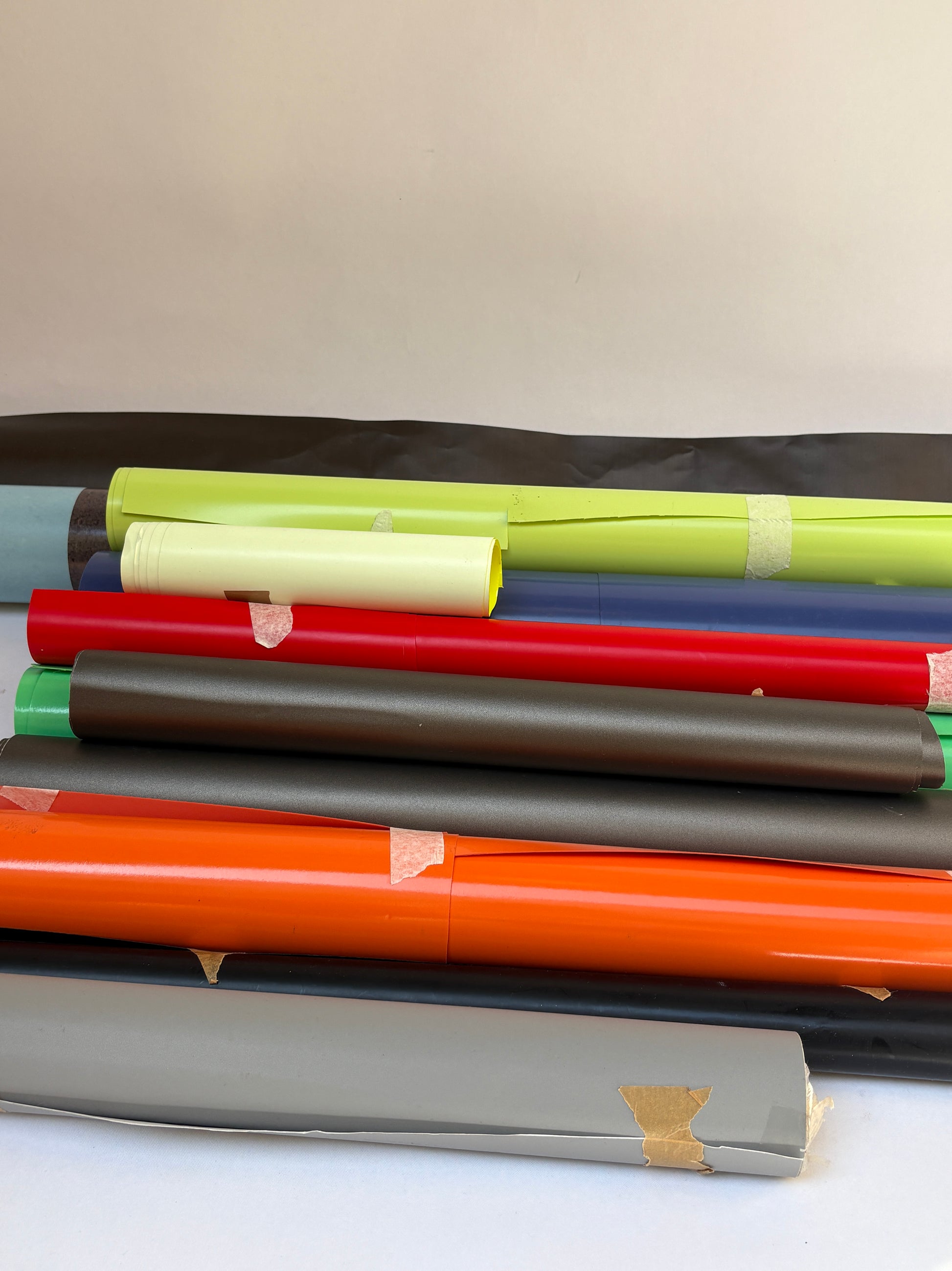 Collection of decorative paper vinyl rolls which are self-adhesive, in various colours 