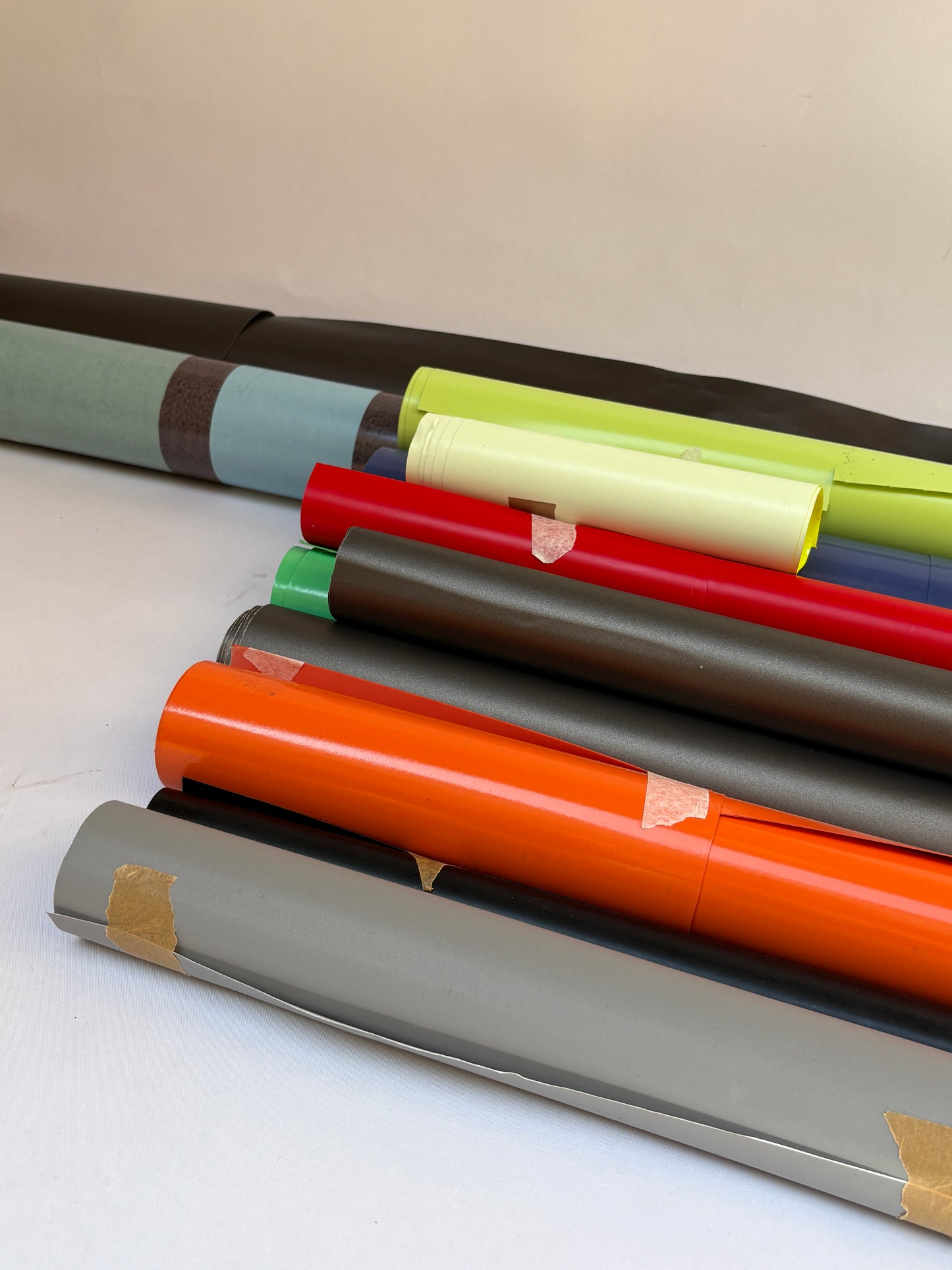 Collection of decorative paper vinyl rolls which are self-adhesive, in various colours 