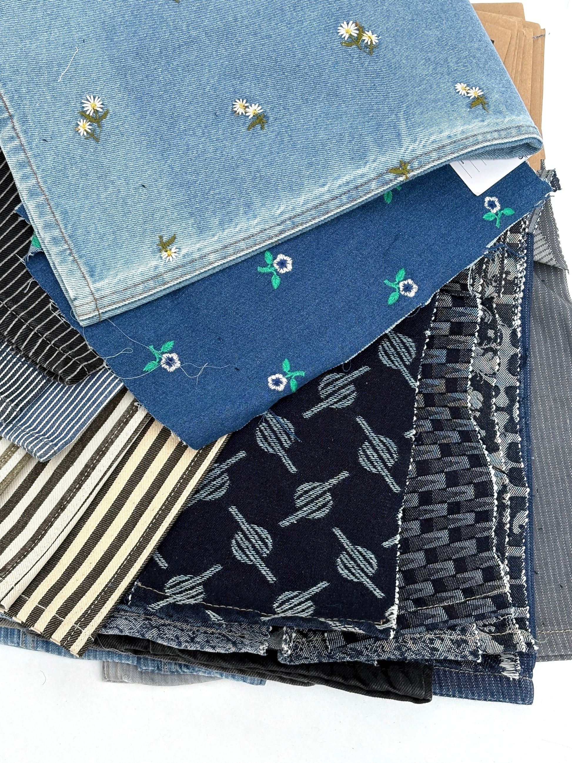 Collection of denim fabric swatches with various patterns