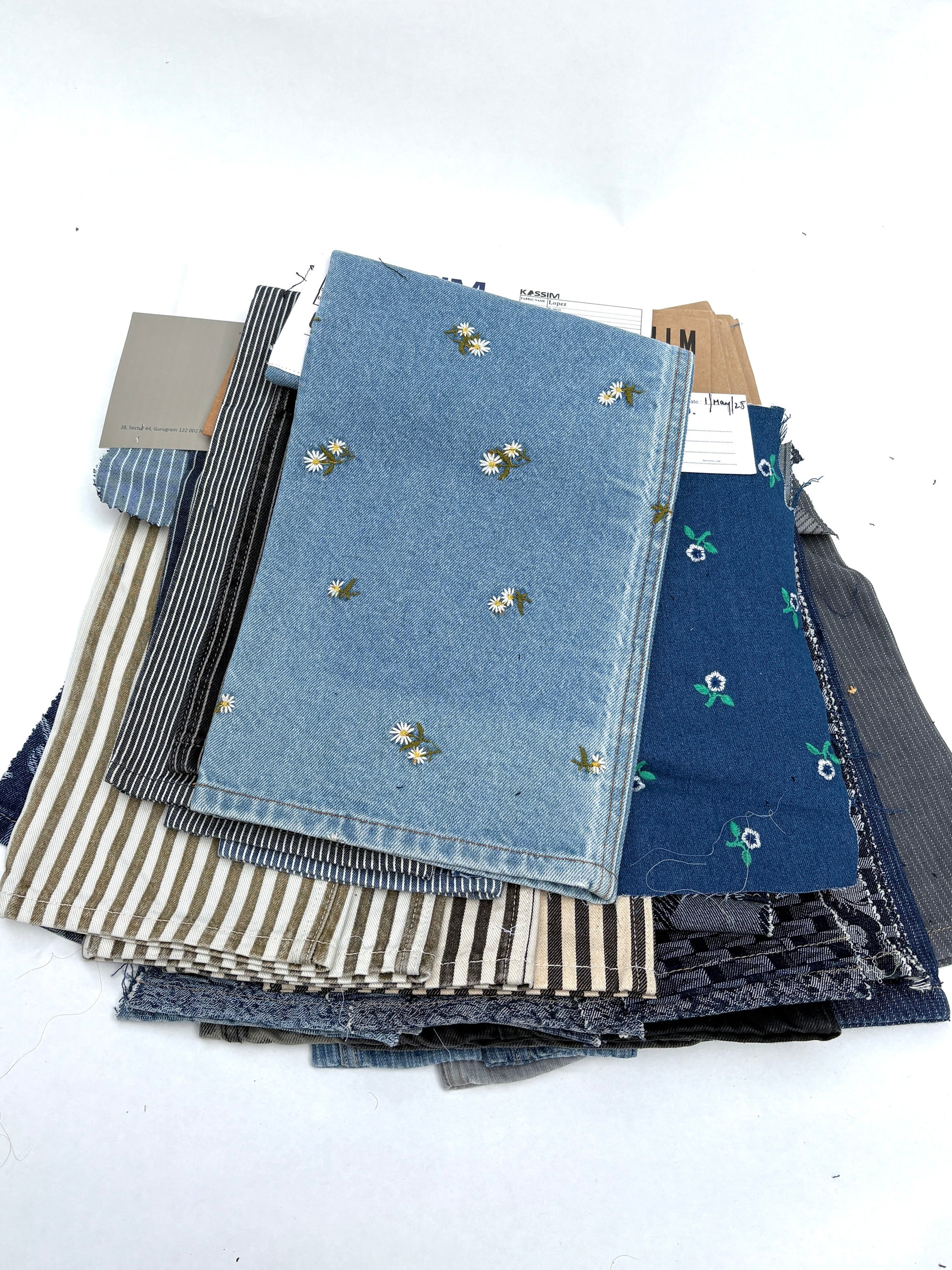 Collection of denim fabric swatches with various patterns