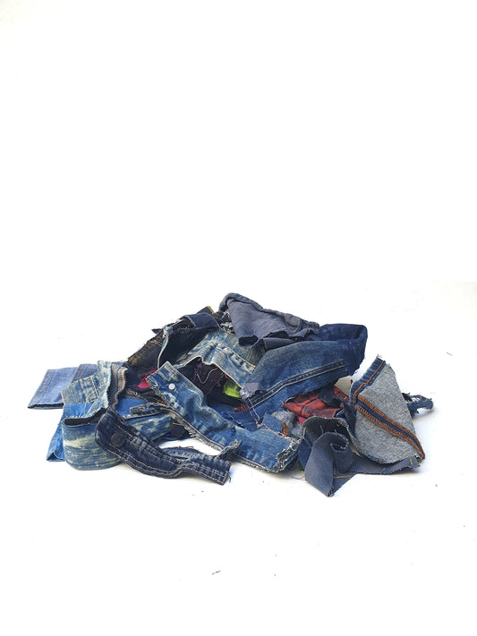 Stack of denim offcuts with various sizes