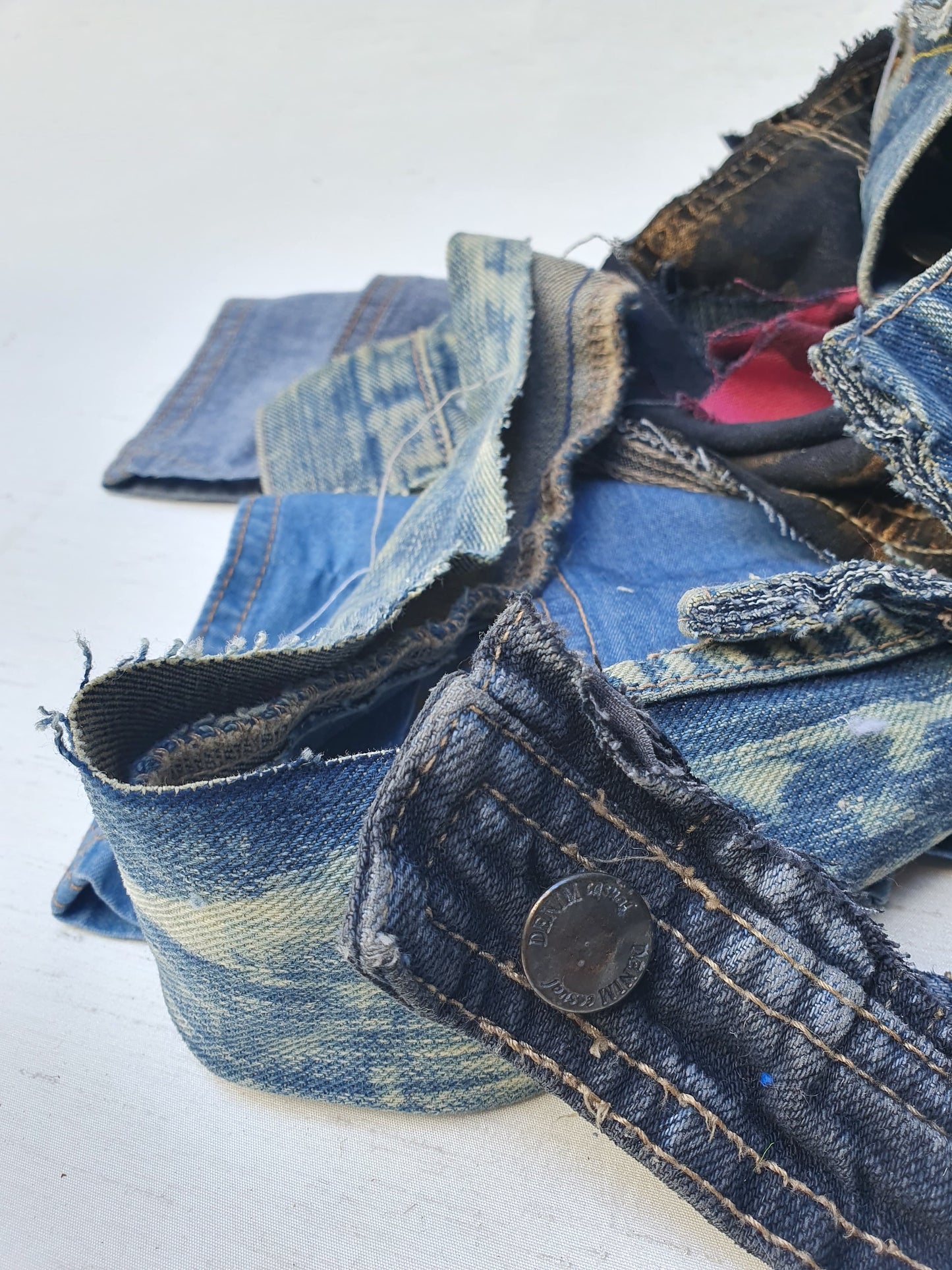 Stack of denim offcuts with various sizes
