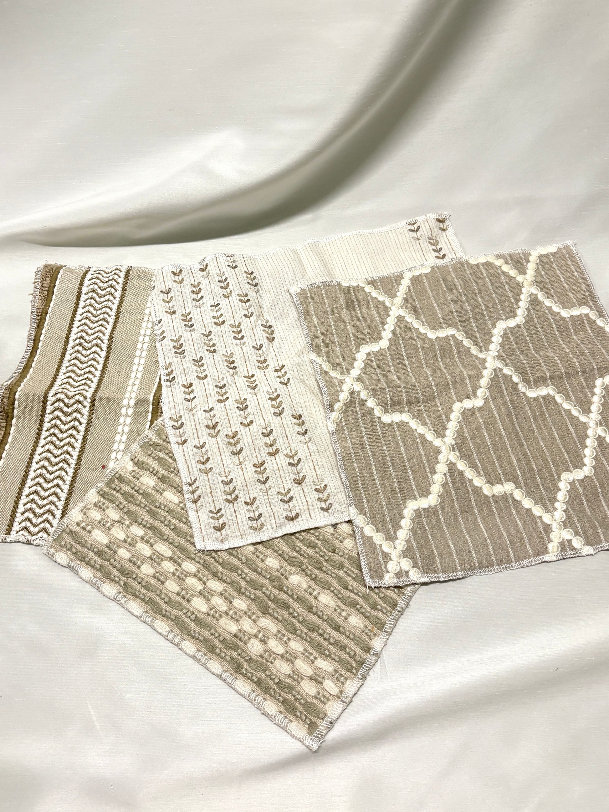 Set of embroidered fabric with various patterns and colours 