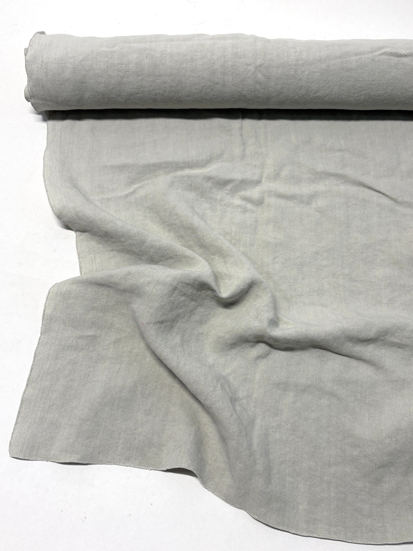 Roll of medium weight linen fabric in grey