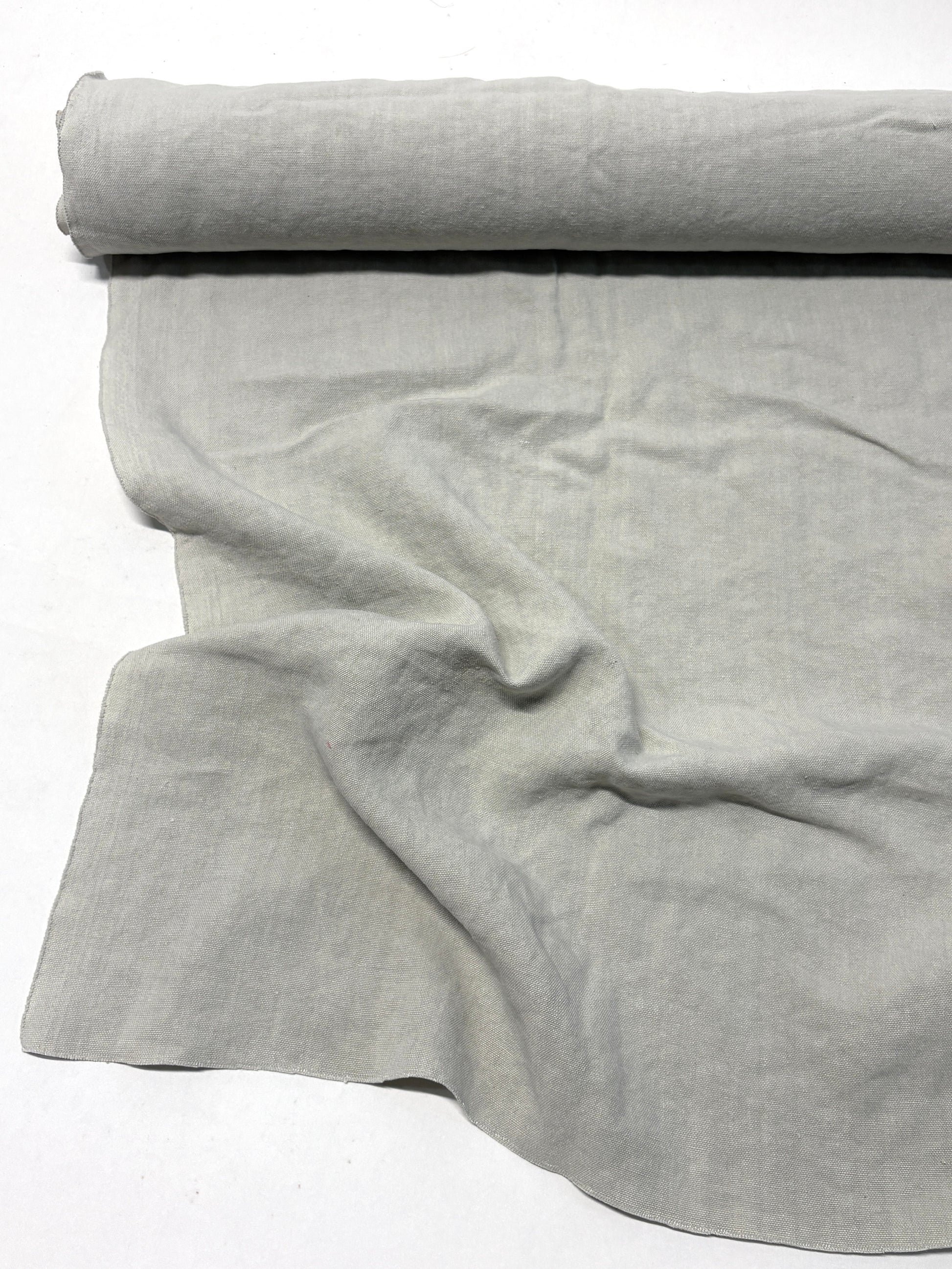 Roll of medium weight linen fabric in grey