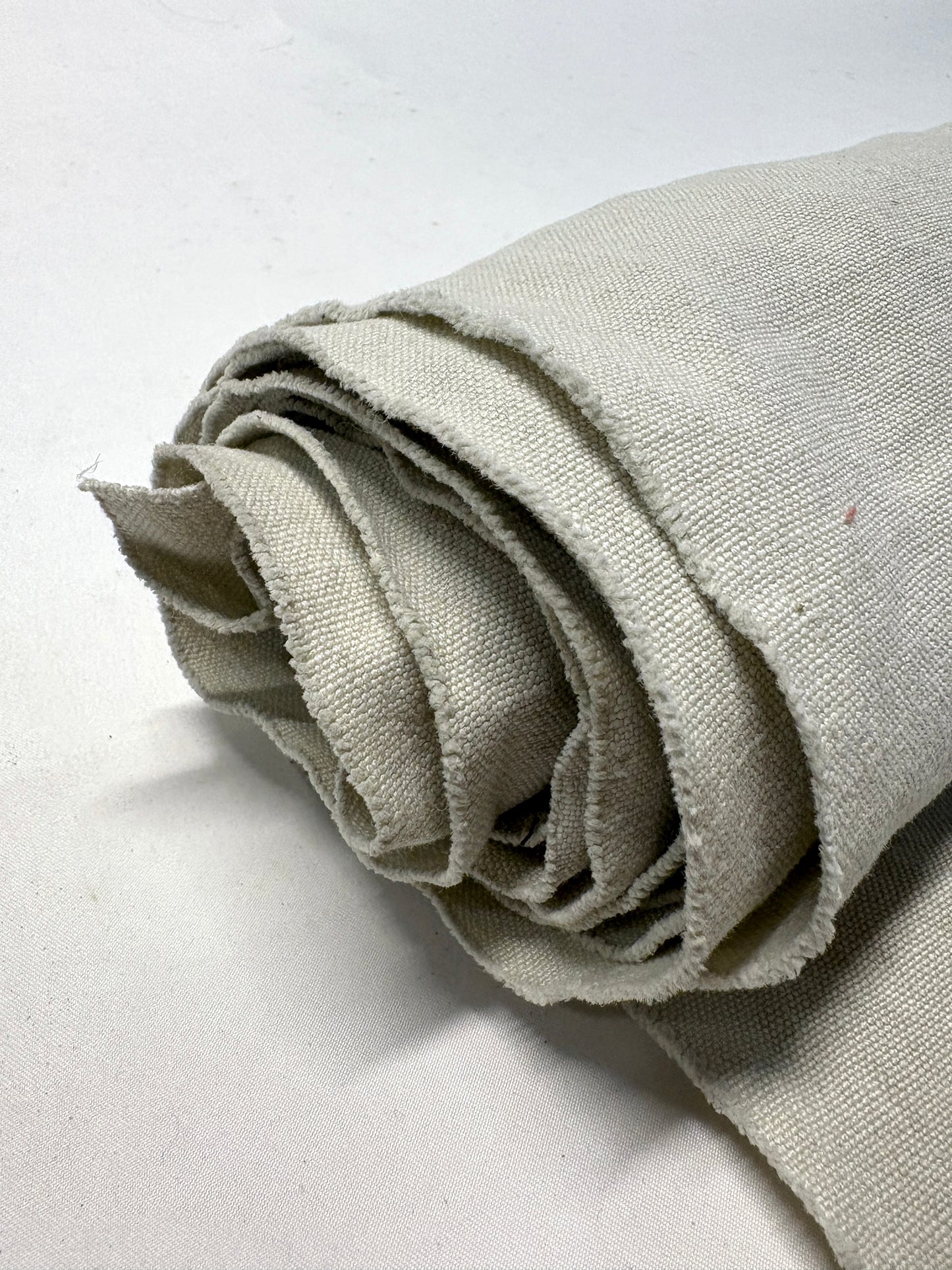 Roll of medium weight linen fabric in grey