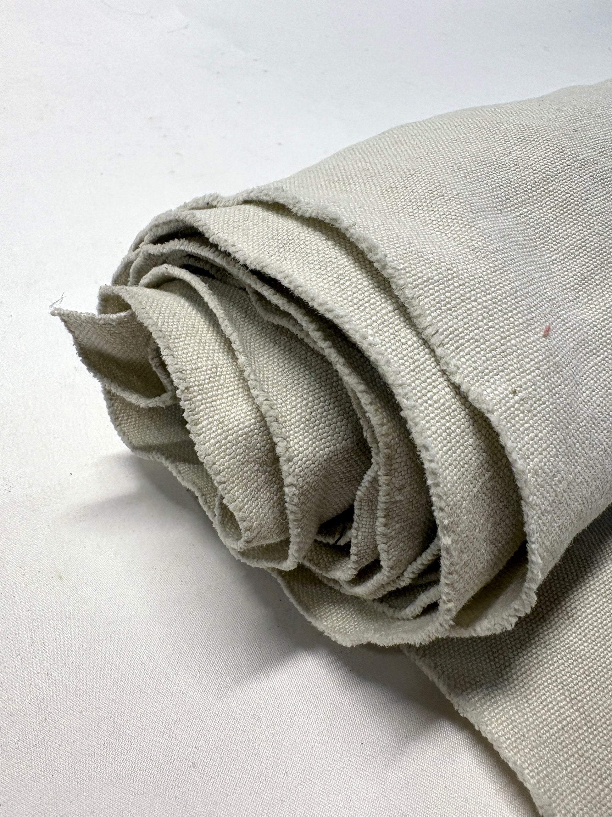 Roll of medium weight linen fabric in grey
