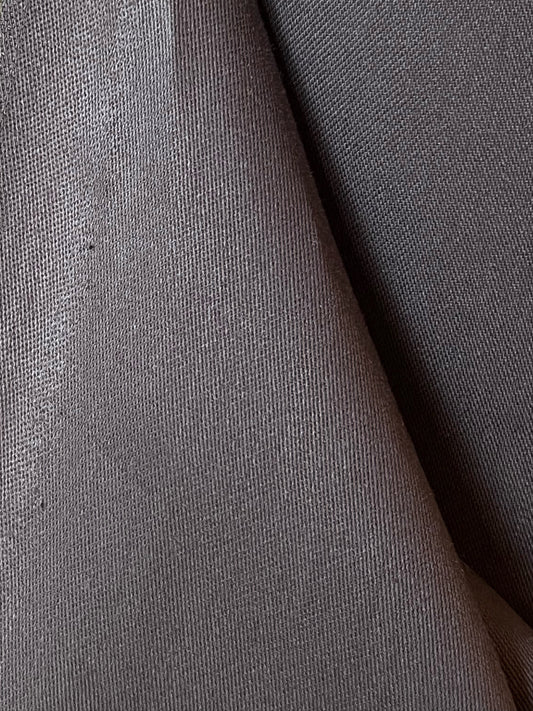 Close-up of organic cotton satin fabric in chocolate brown