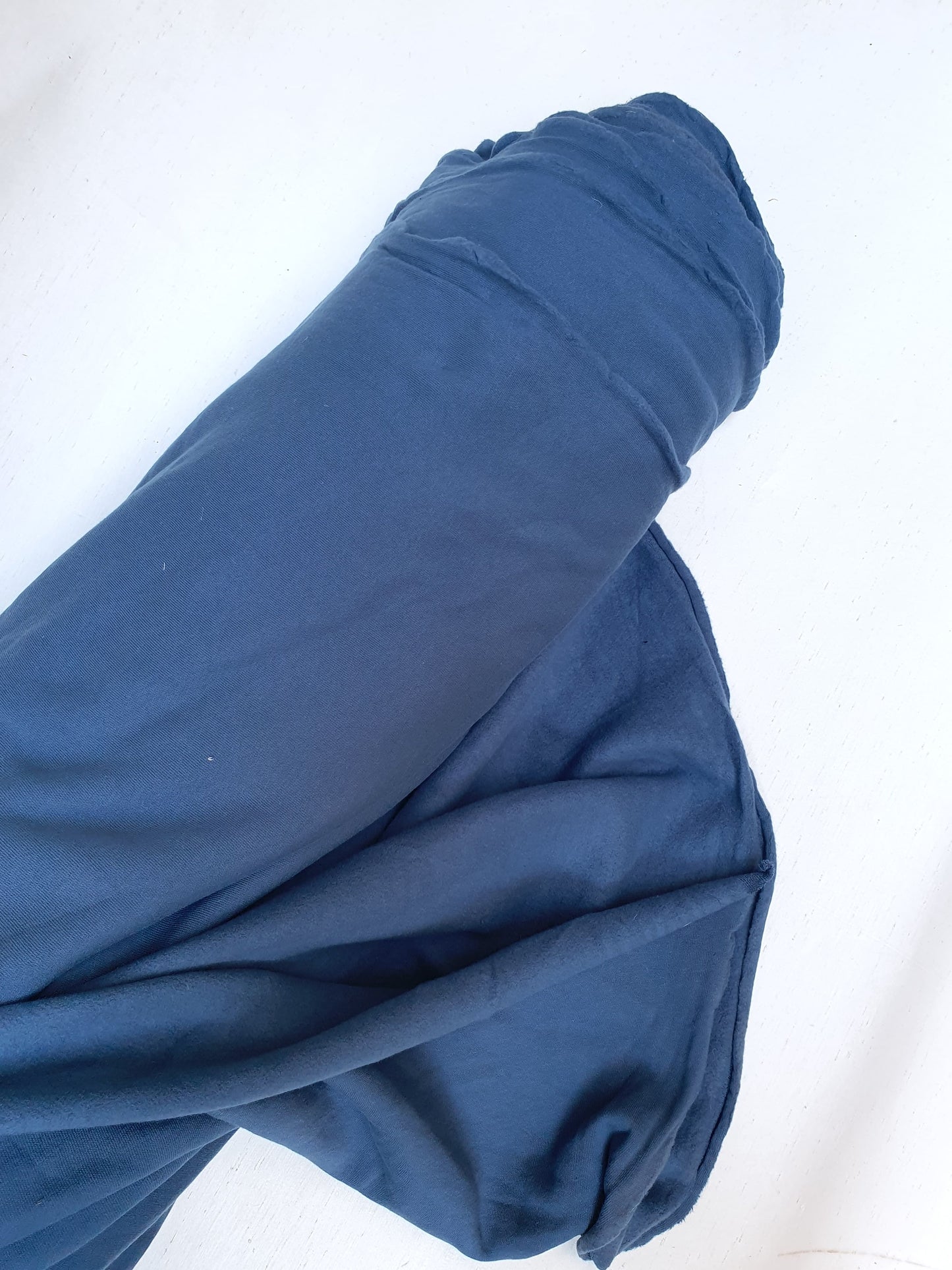 Roll of brushed jersey fabric in blue