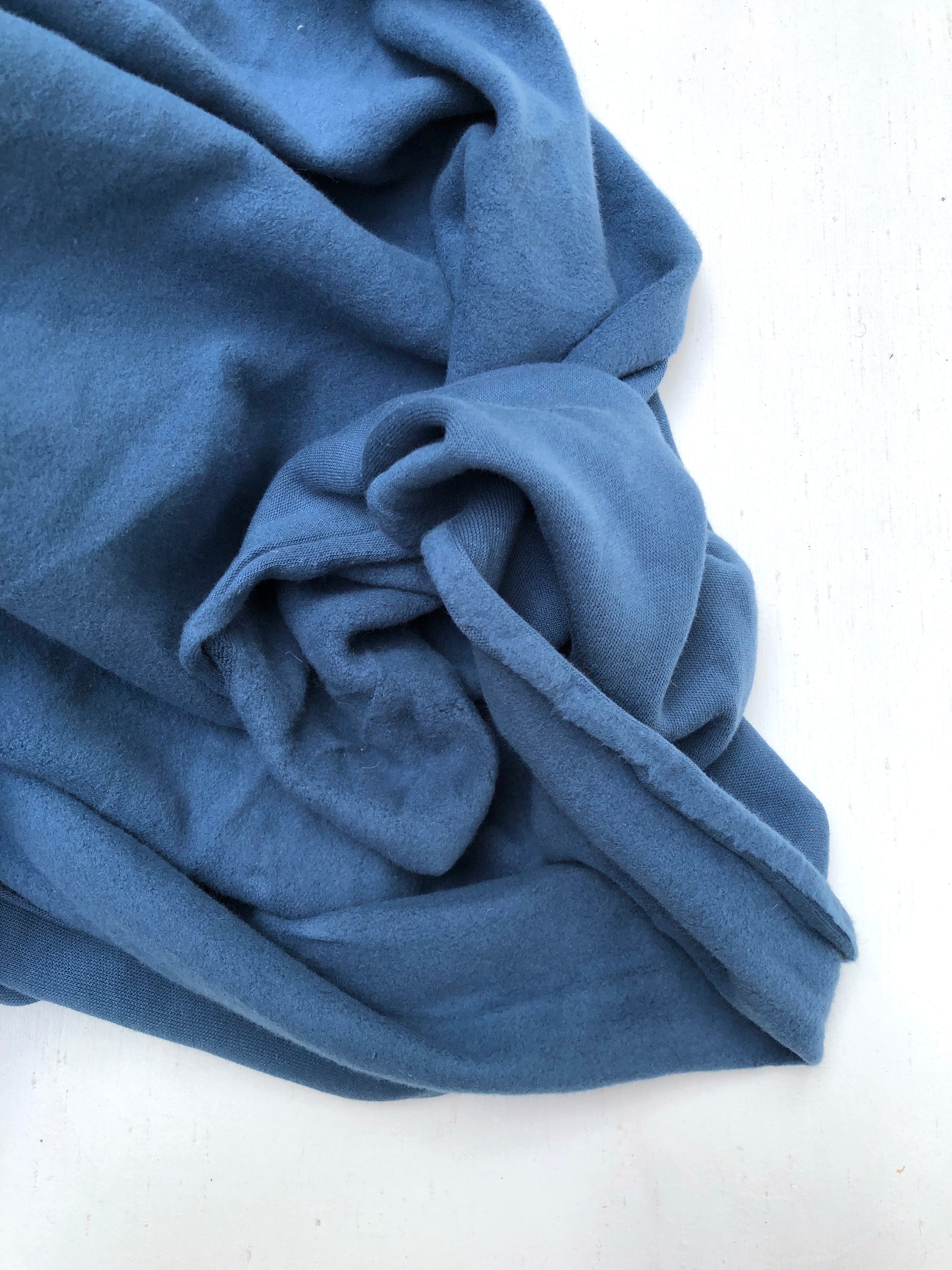 Close-up of brushed jersey fabric in blue
