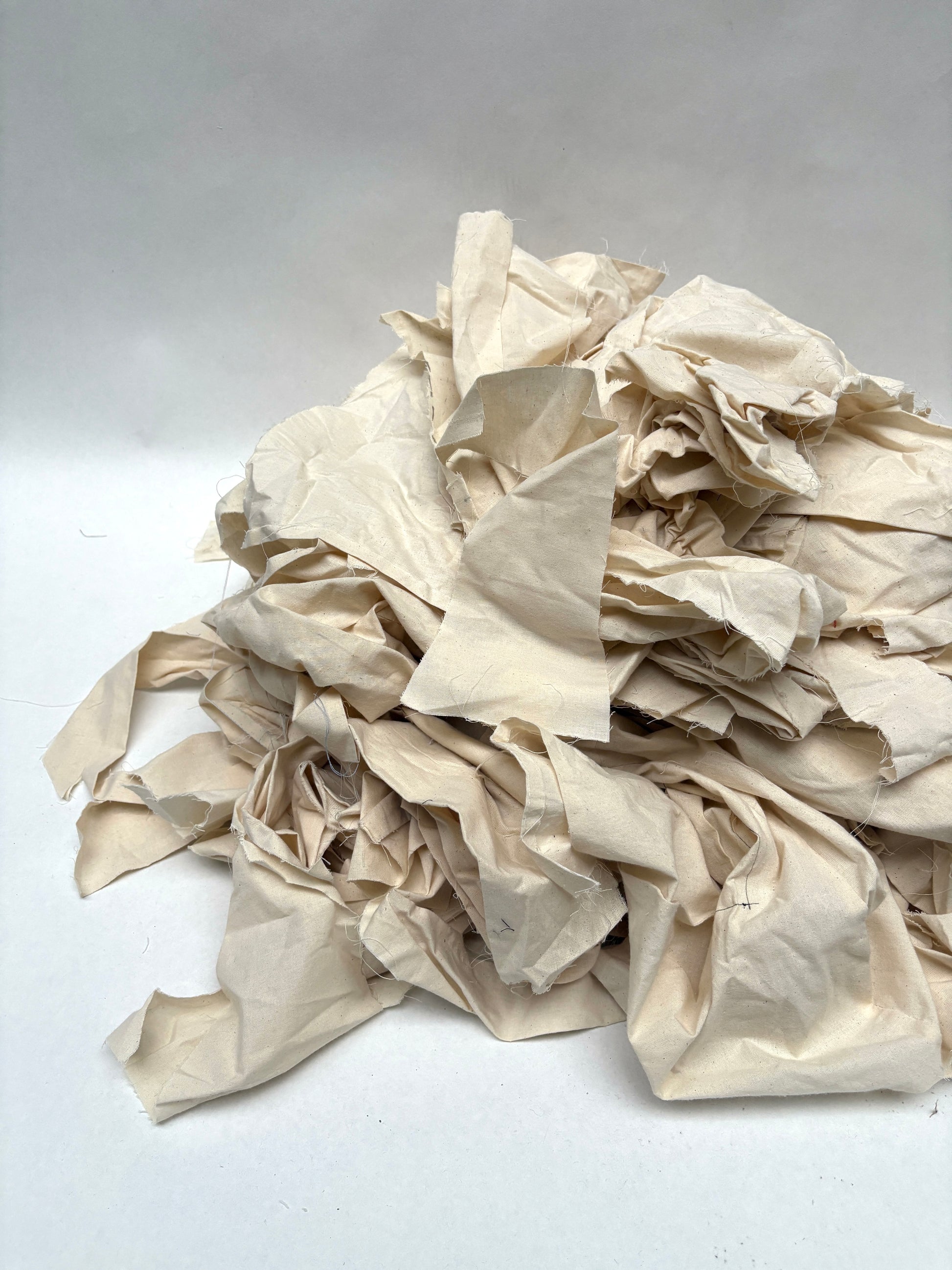 Stack of canvas offcuts fabric in white