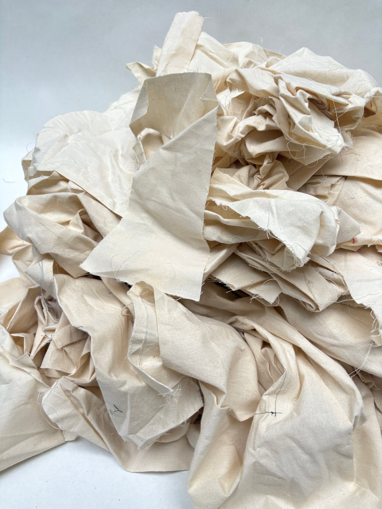 Stack of canvas offcuts fabric in white