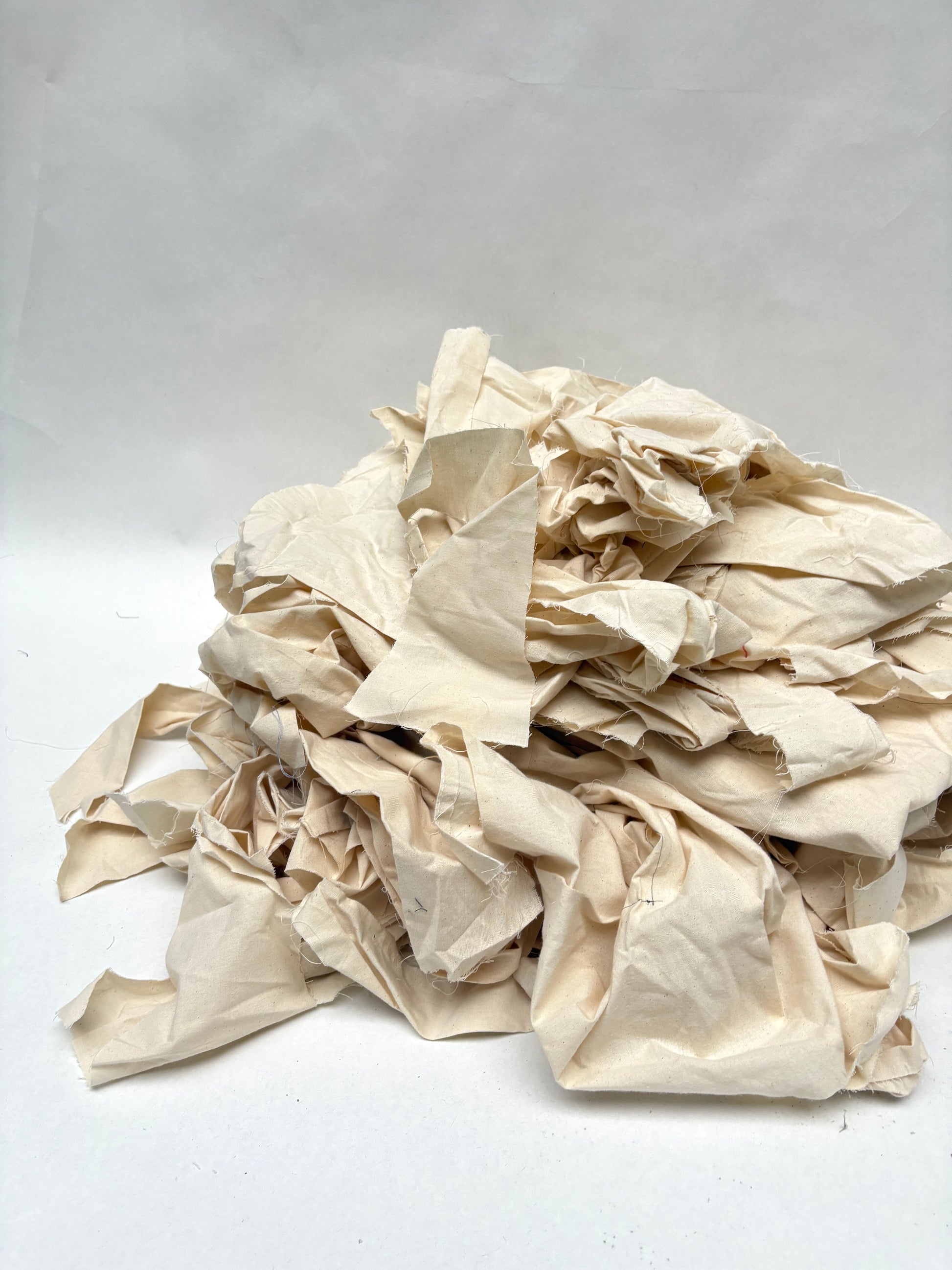 Stack of canvas offcuts fabric in white