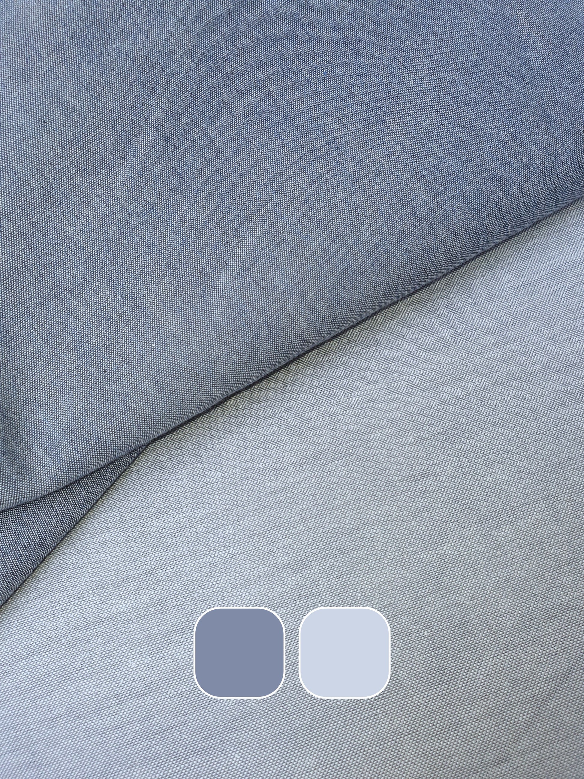 Close-up of chambray cotton fabric in blue-grey with colour swatches below