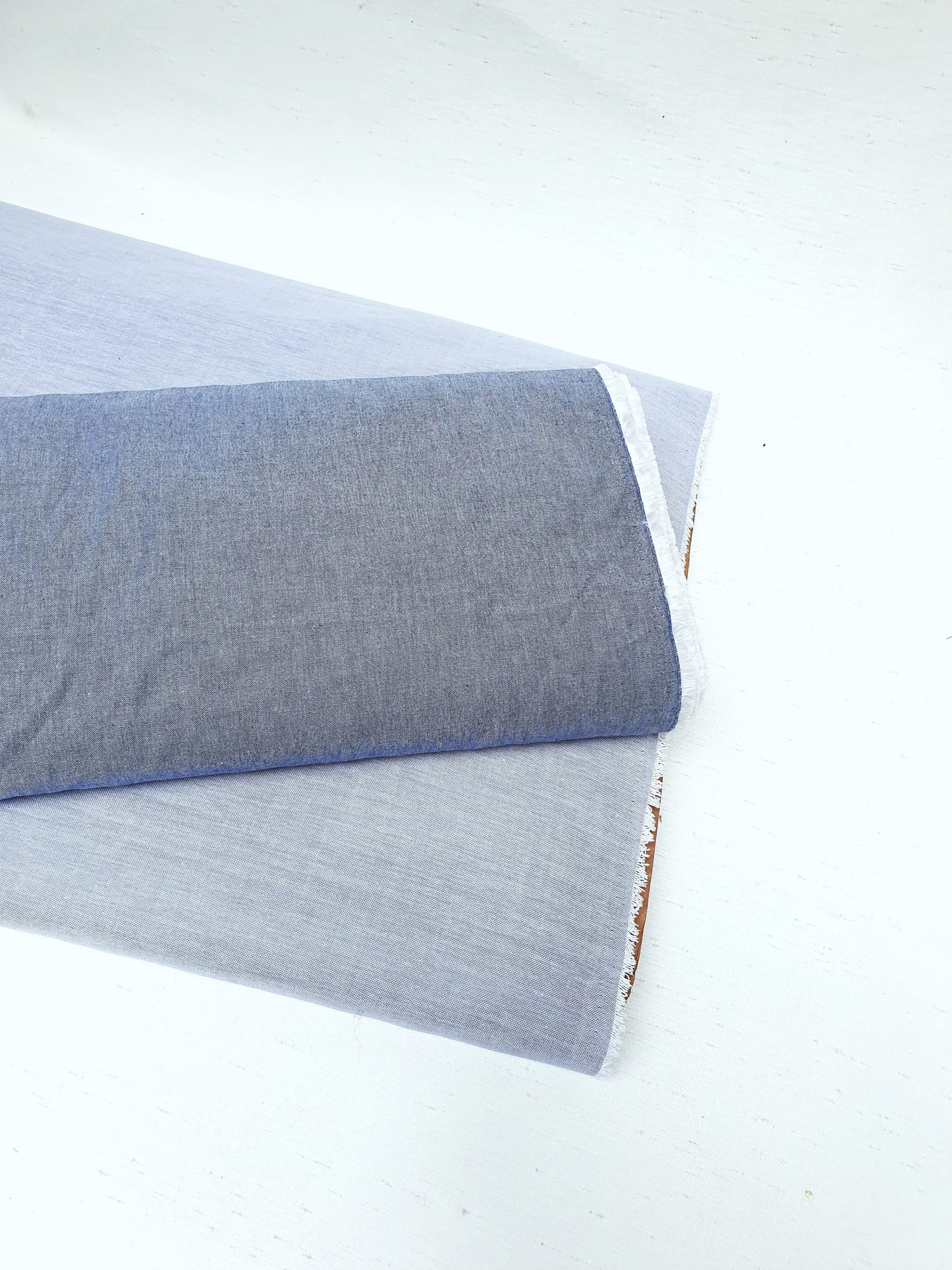 Close-up of chambray cotton fabric in blue-grey 