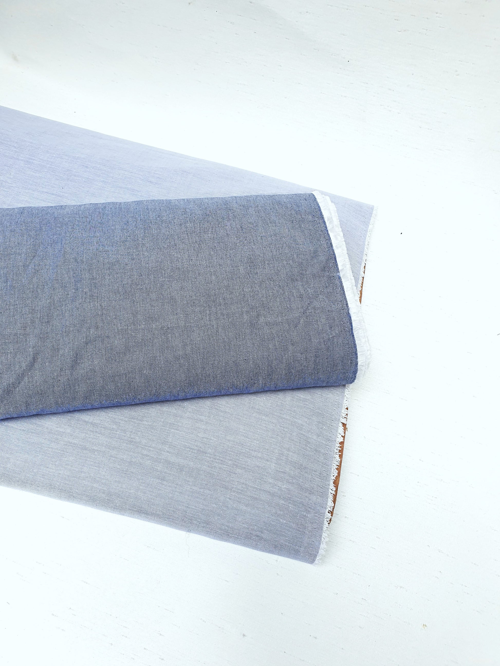 Close-up of chambray cotton fabric in blue-grey 