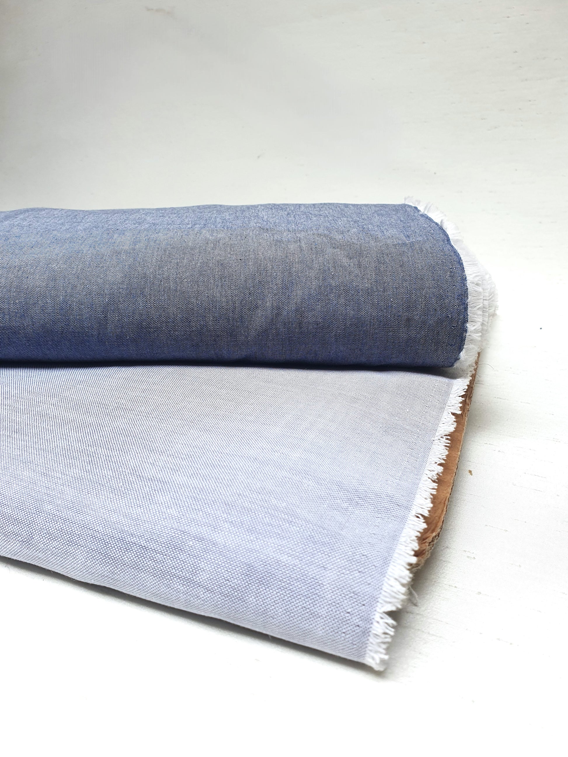 Close-up of chambray cotton fabric in blue-grey