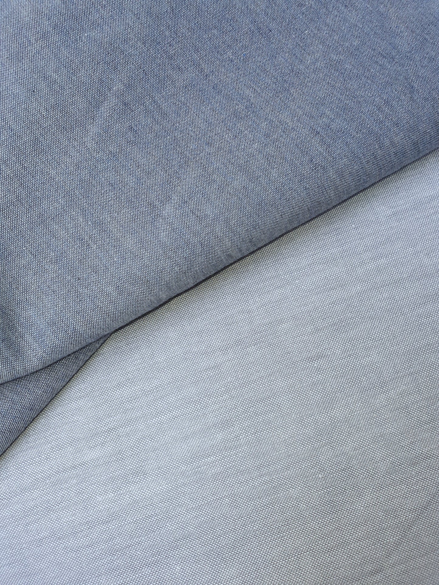 Close-up of chambray cotton fabric in blue-grey