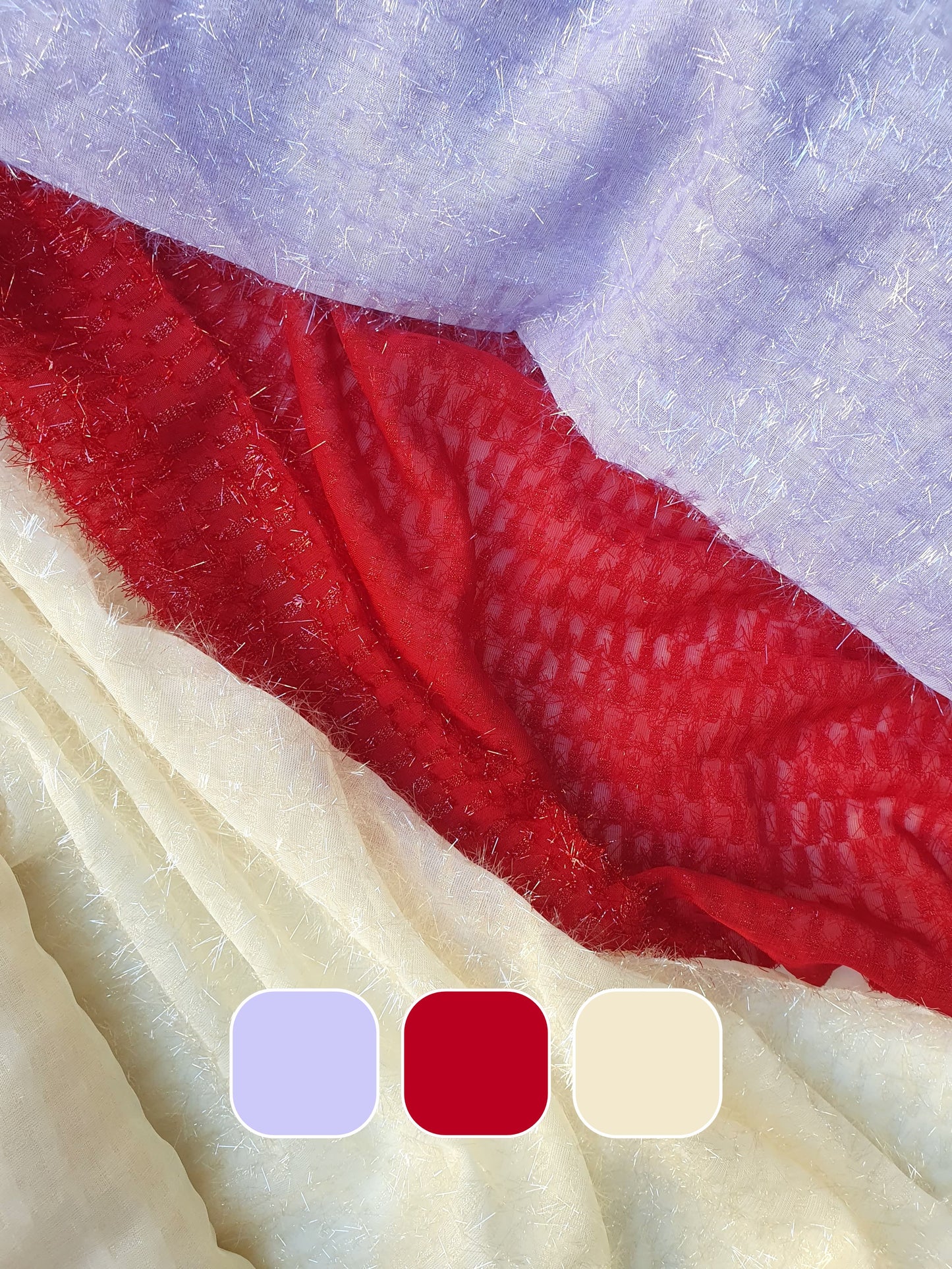 Close-up of sparkly embroidered fabric in red, lilac and cream, colour swatches below