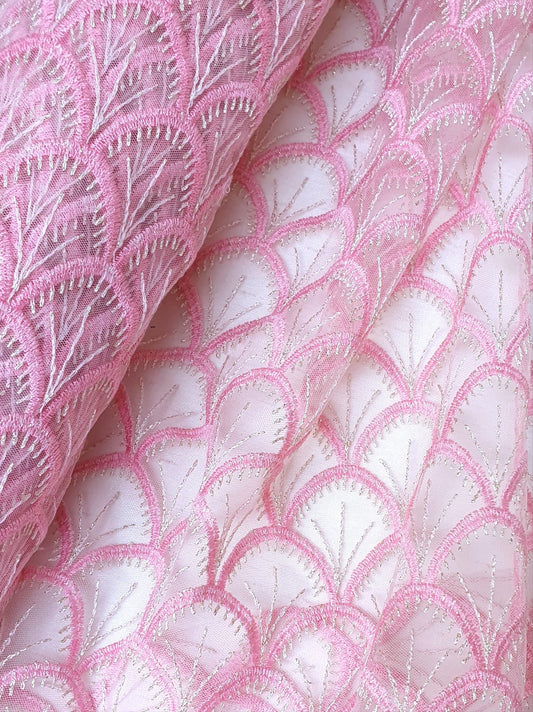 Close-up of embroidery lace fabric in pink 