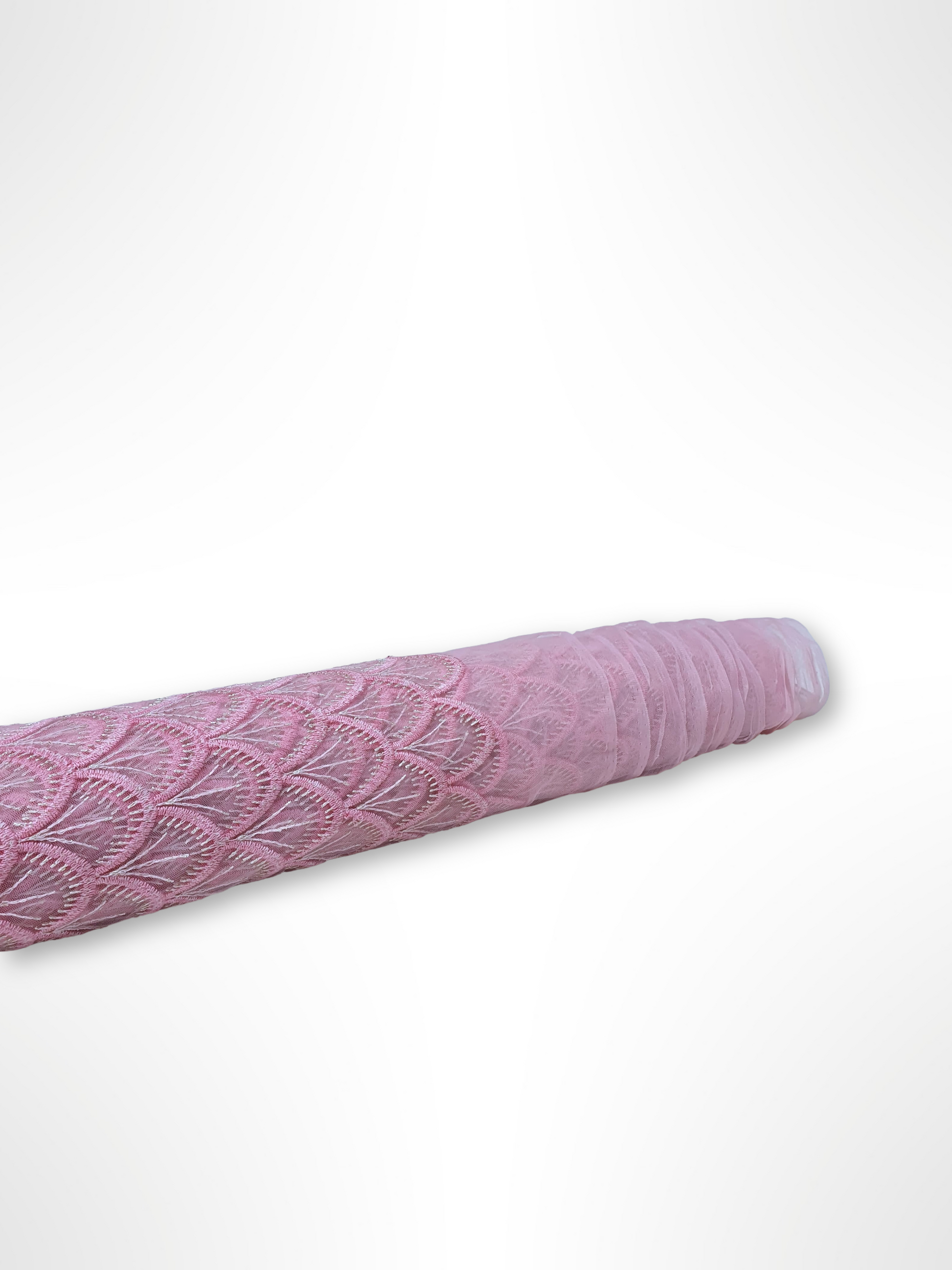 Roll of embroidery lace fabric in pink 