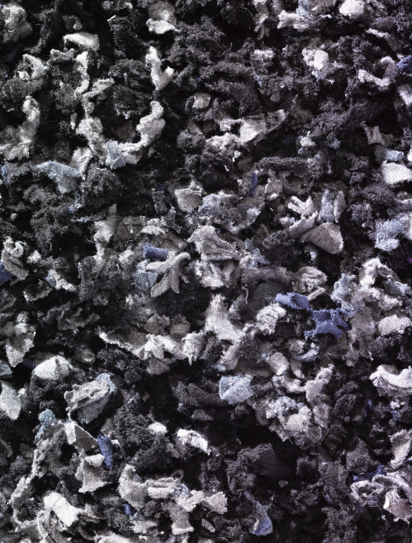 Shredded fibres textiles fabric in black and grey 