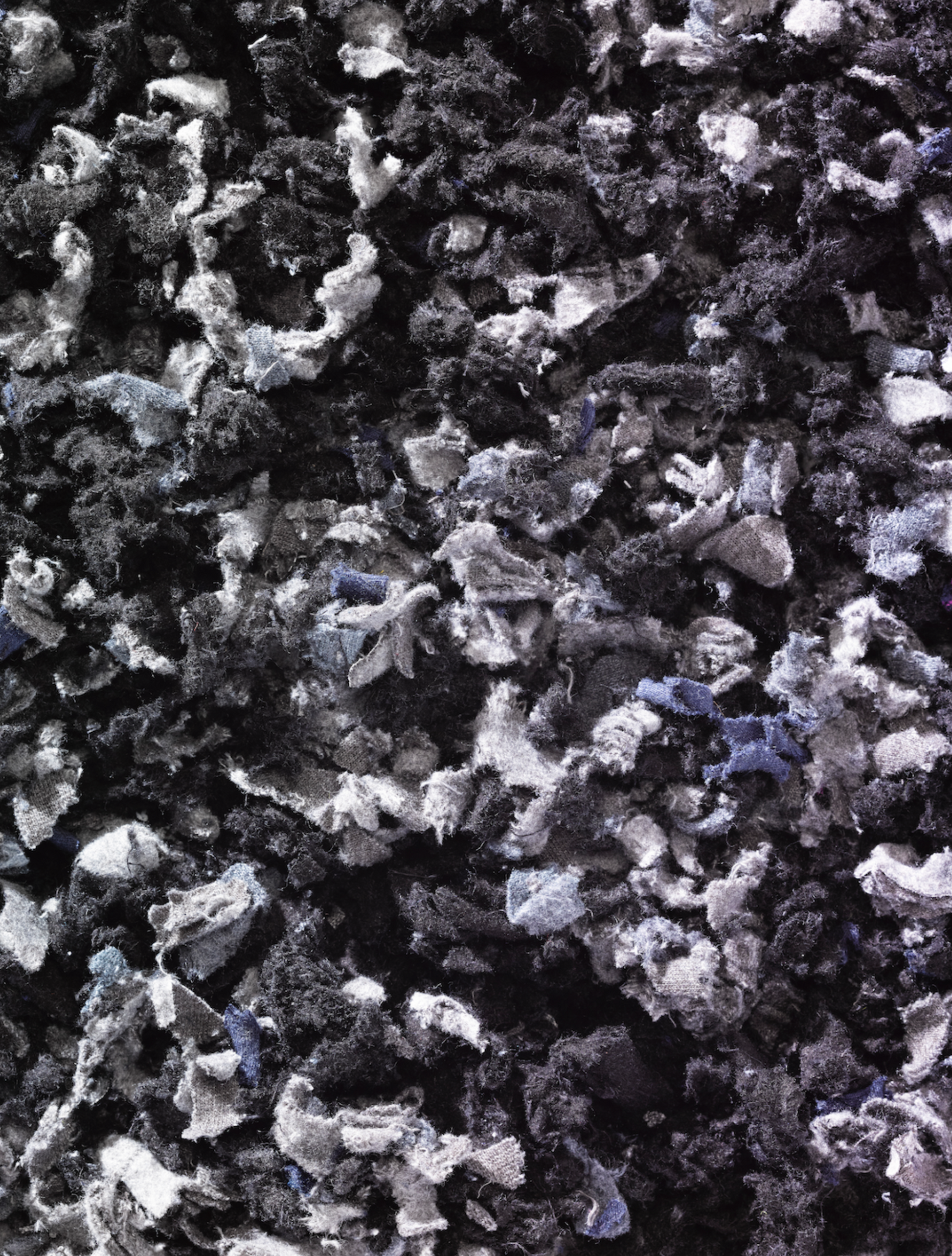 Shredded fibres textiles fabric in black and grey 