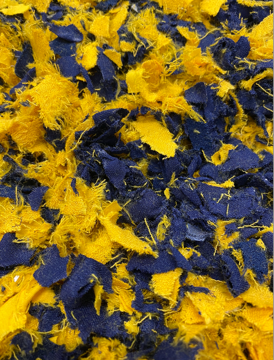Shredded fibres textiles fabric in navy mustard 