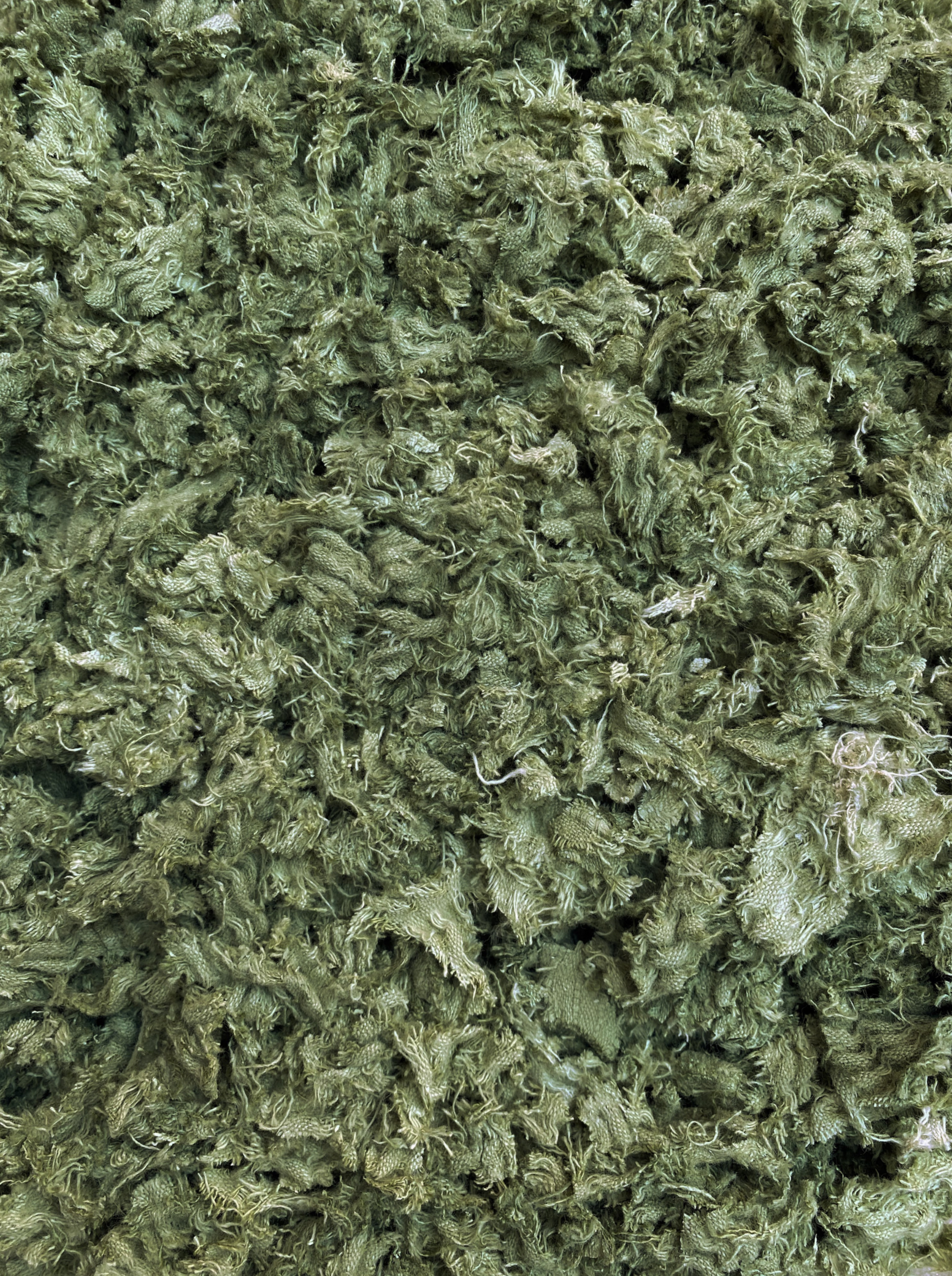 Shredded fibres textile fabric in pistachio green 